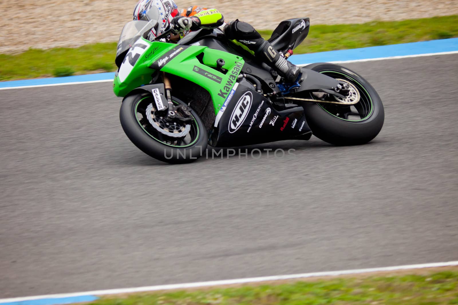 JEREZ DE LA FRONTERA, SPAIN - NOV 20: Stock Extreme motorcyclist Oscar Ibañez takes a curve in the CEV championship on Nov 20, 2010, in Jerez de la Frontera, Spain