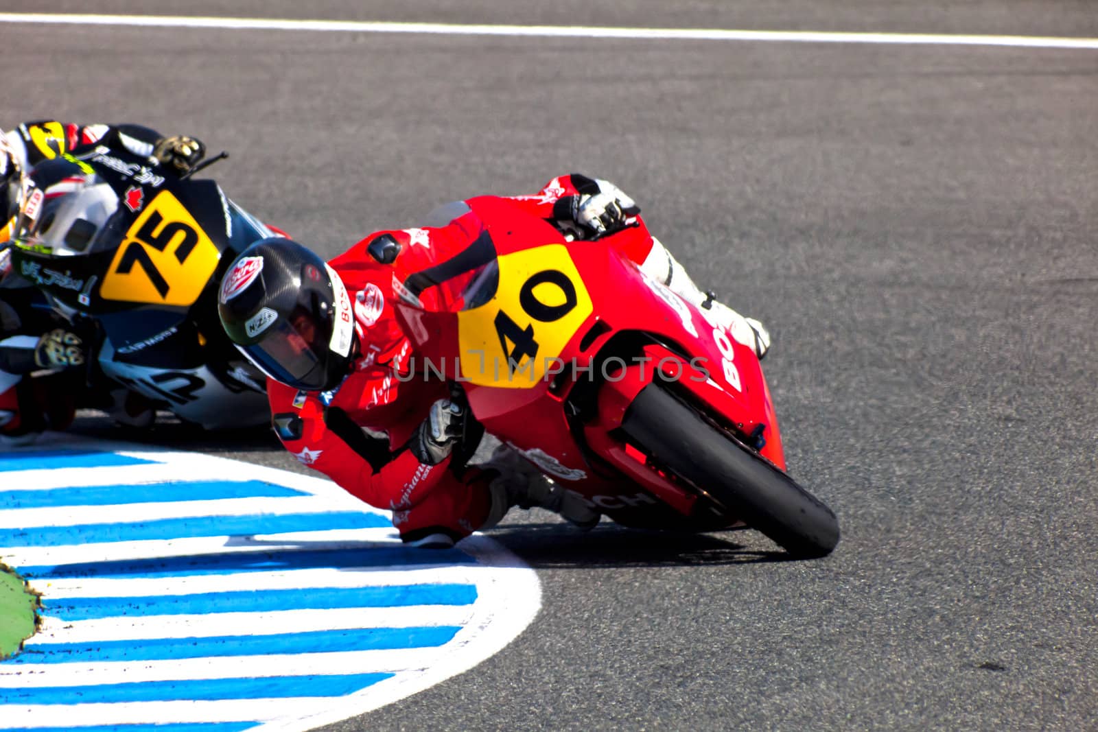 JEREZ DE LA FRONTERA, SPAIN - APR 17: Moto2 motorcyclist Roman Ramos and Tomoyoshi Koyama takes a curve in the CEV Championship race on April 17, 2011 in Jerez de la Frontera, Spain.