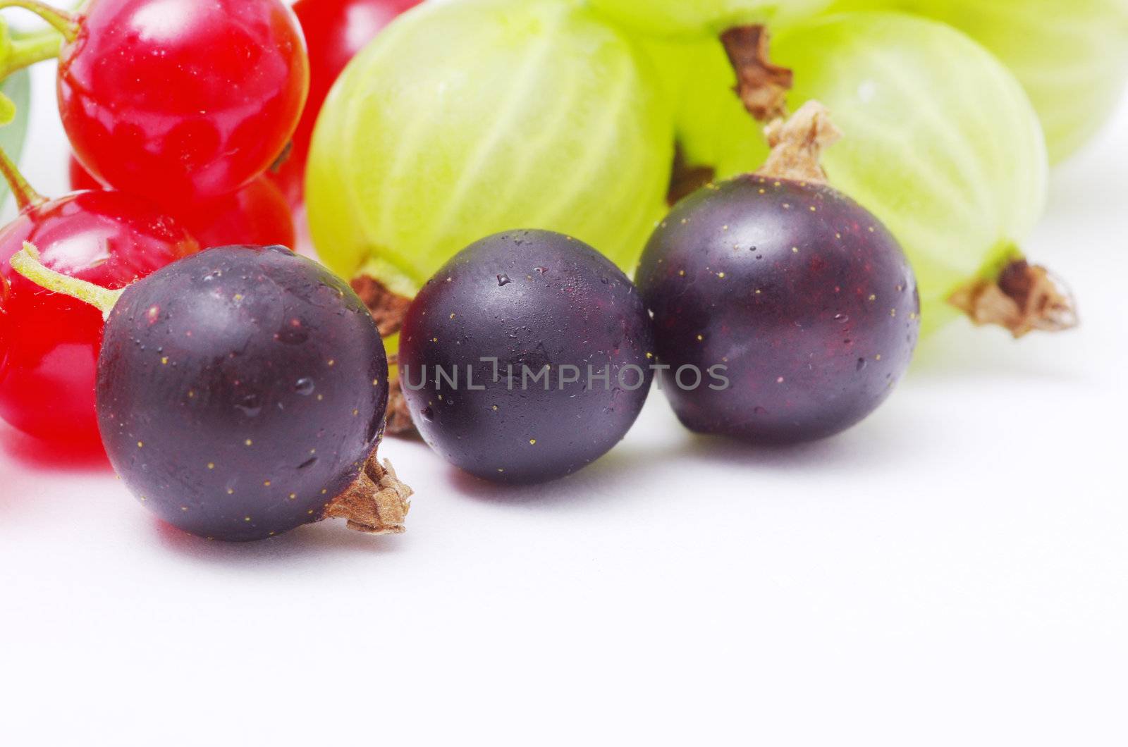 Fresh delicious summer berries isolated on white