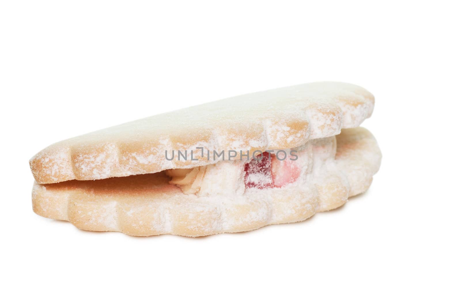 Single pastry with cream isolated over white background