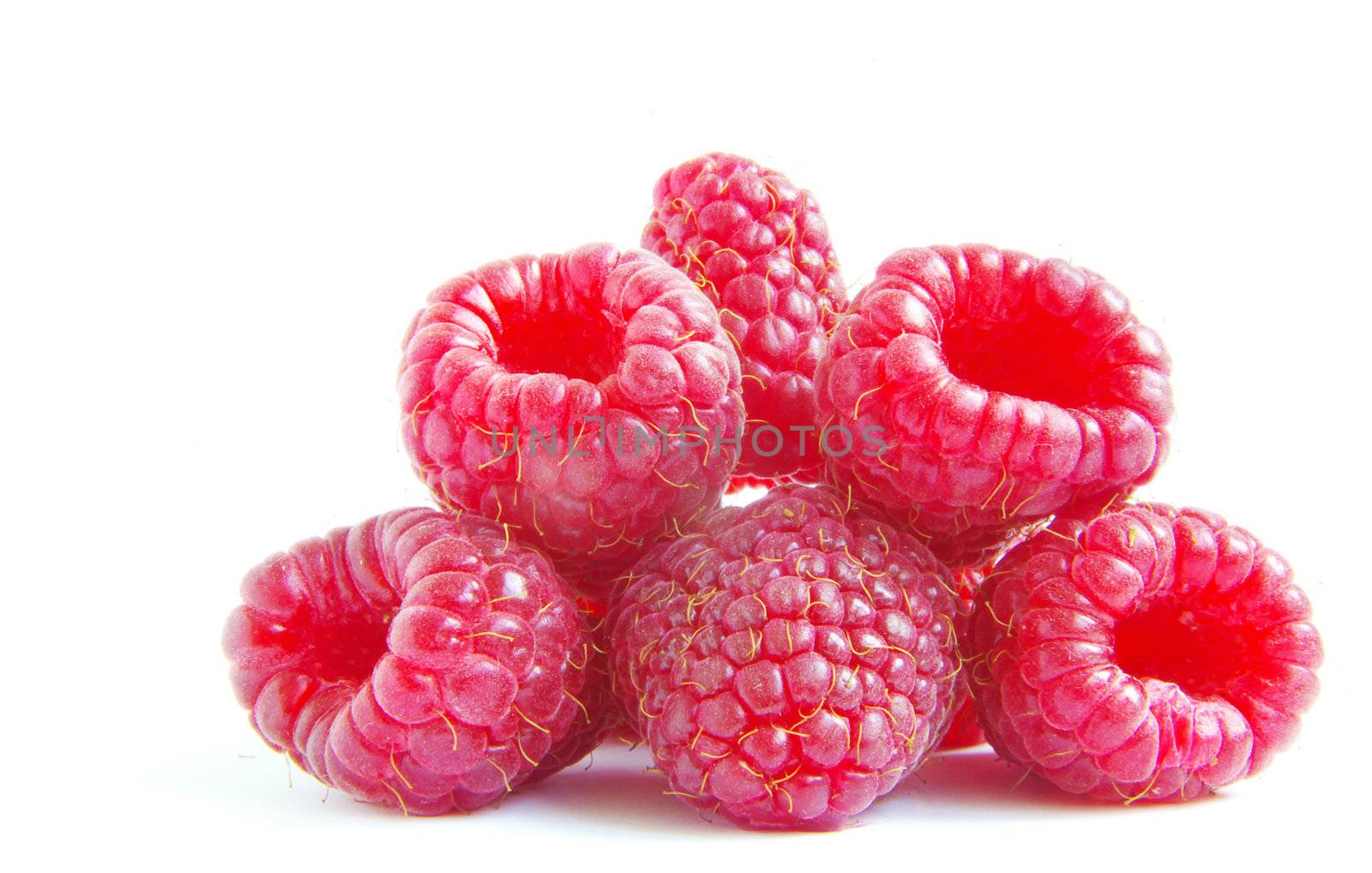 Ripe raspberry on a white background