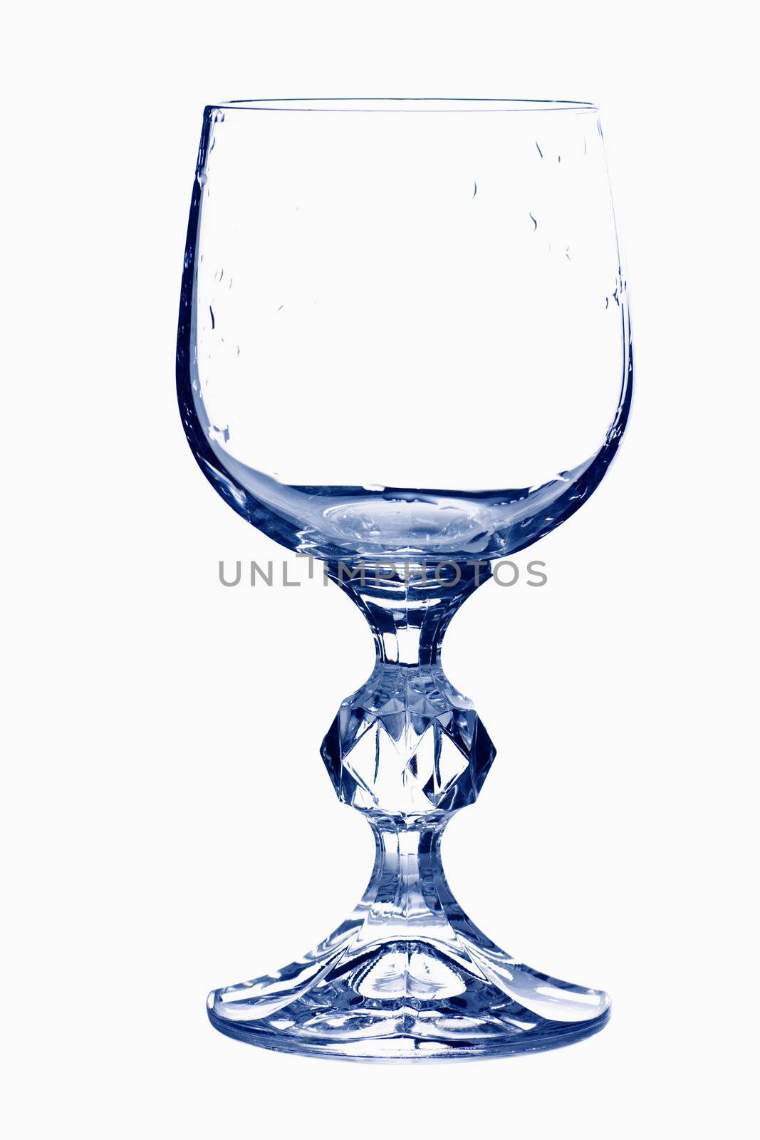 Empty wine glass in blue tones isolated over white