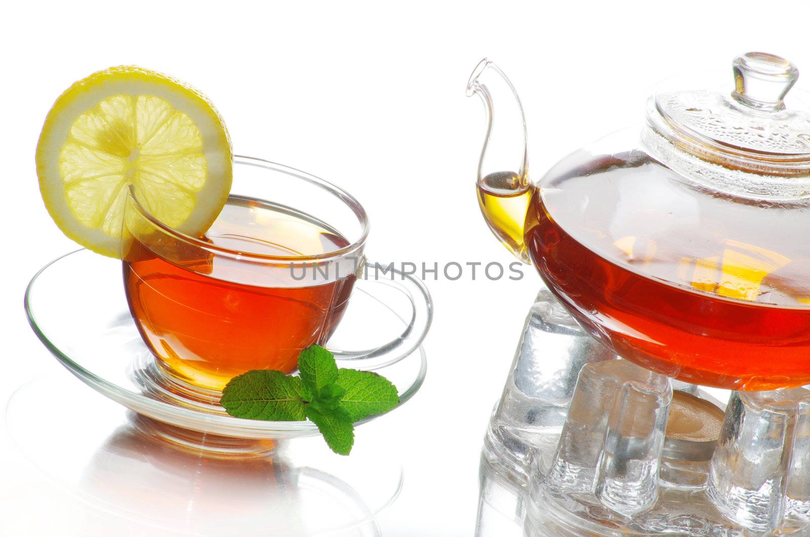 Tea being poured into glass tea cup