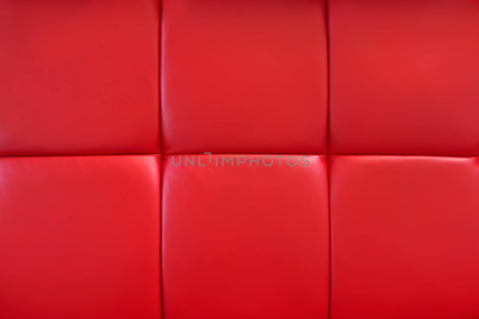 Covering of furniture with bright red artificial material