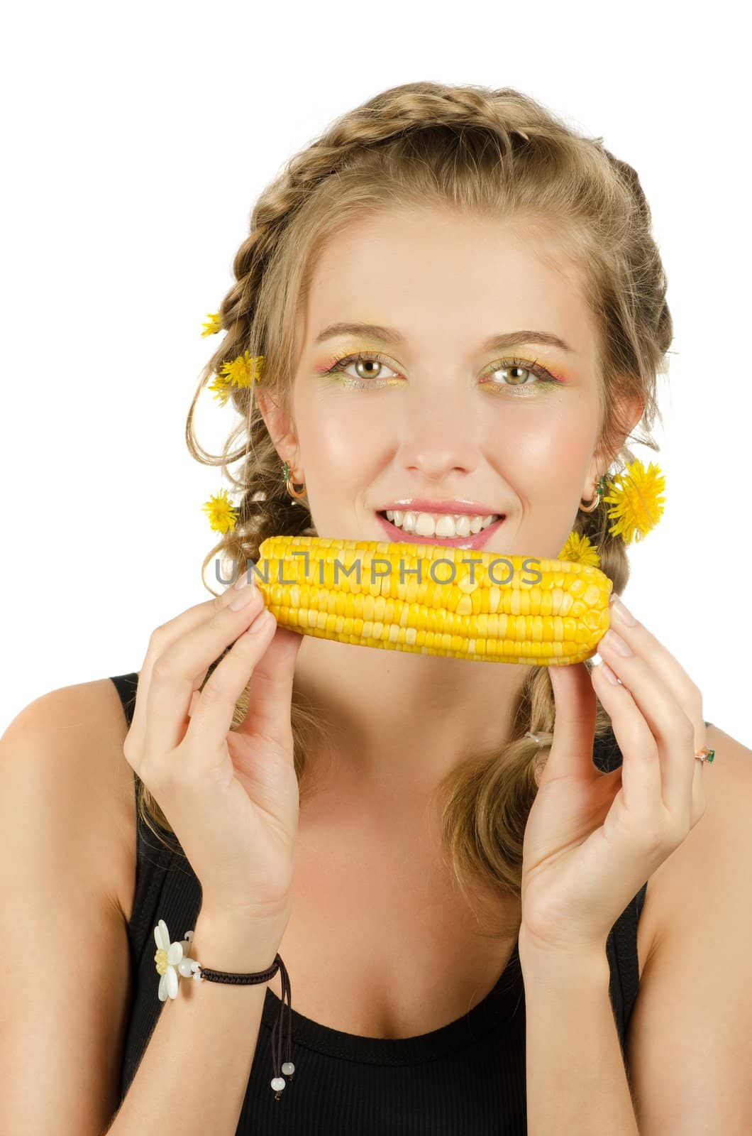Close-up portrait of young beauty woman eating corn-cob on a white