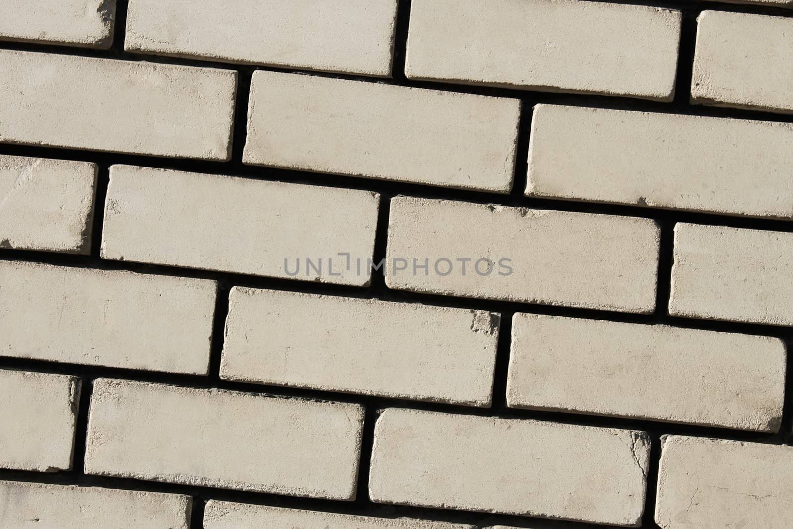 Detail of wall with light bricks. Contrast texture