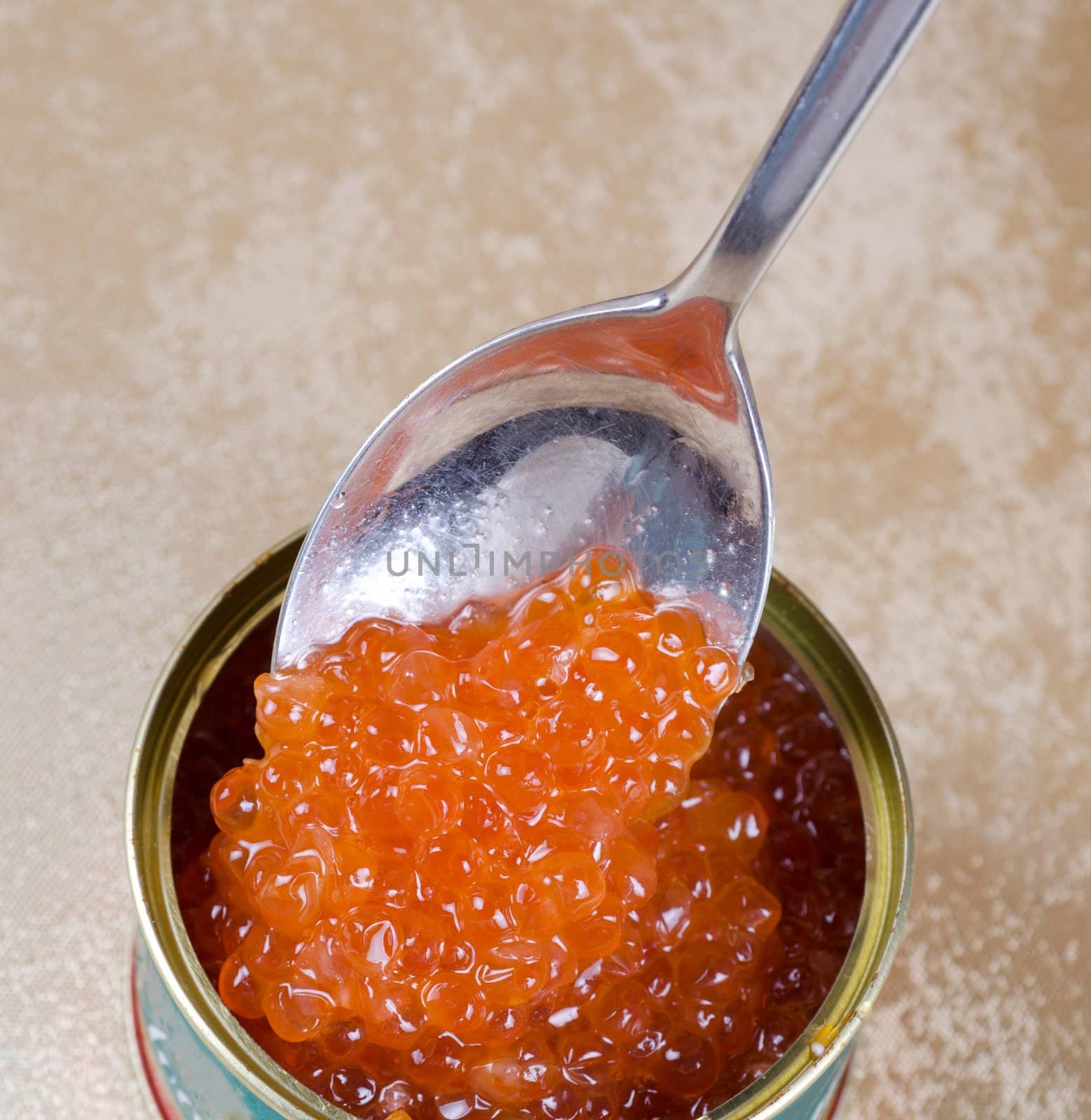 Canned salmon red caviar with spoon closeup