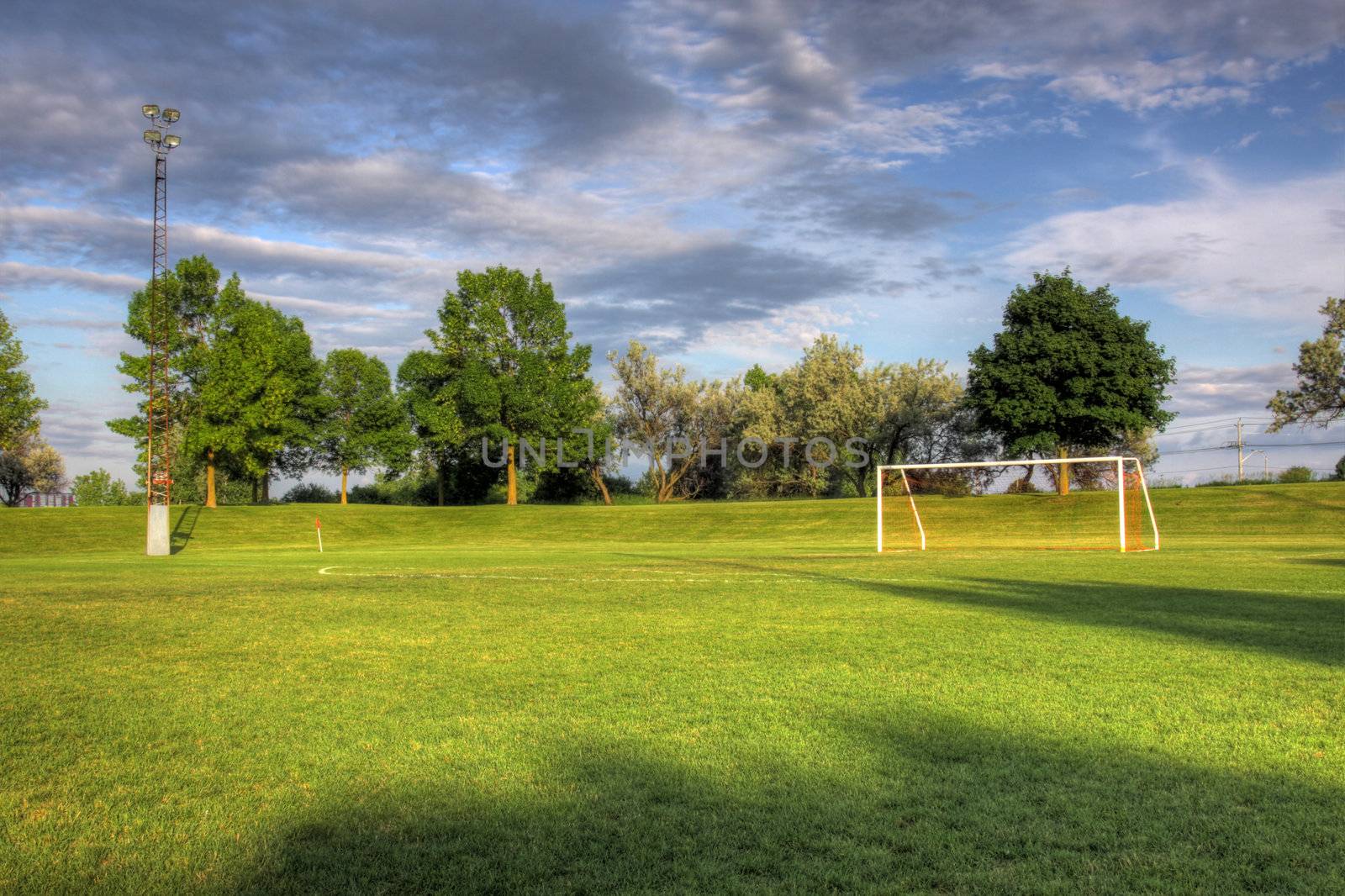 An empty soccer goal with trees in the background. (HDR photo)
