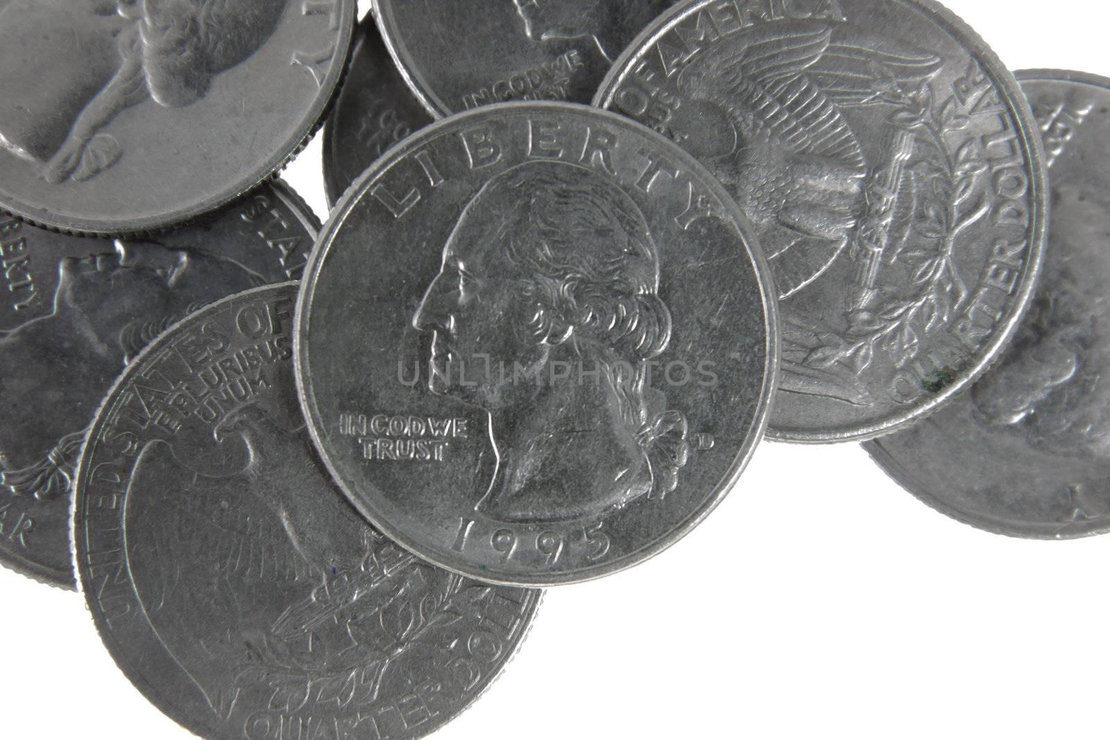 A pile of US quarters isolated on a white background.