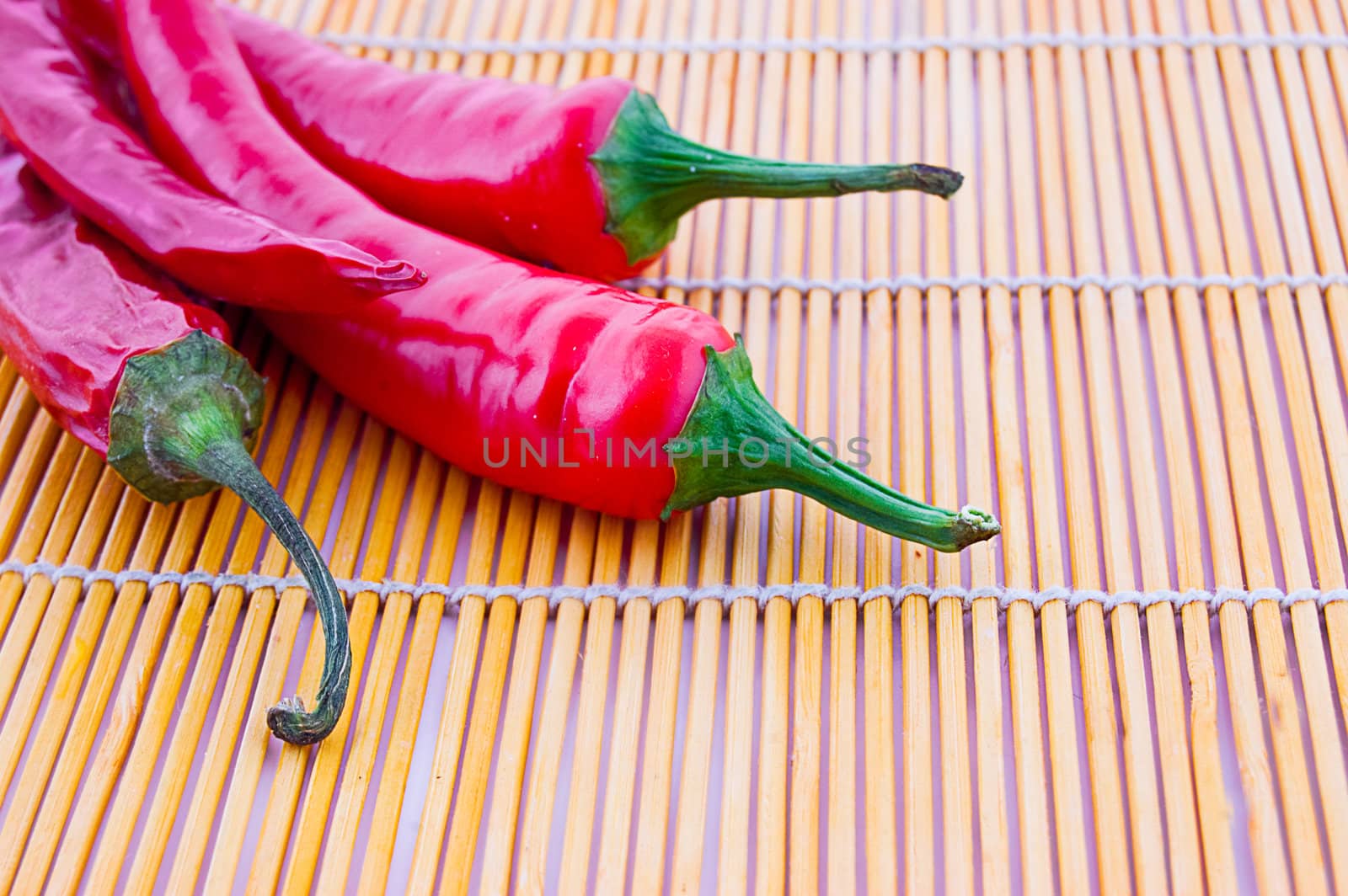 Red chilli peppers on wooden cloth