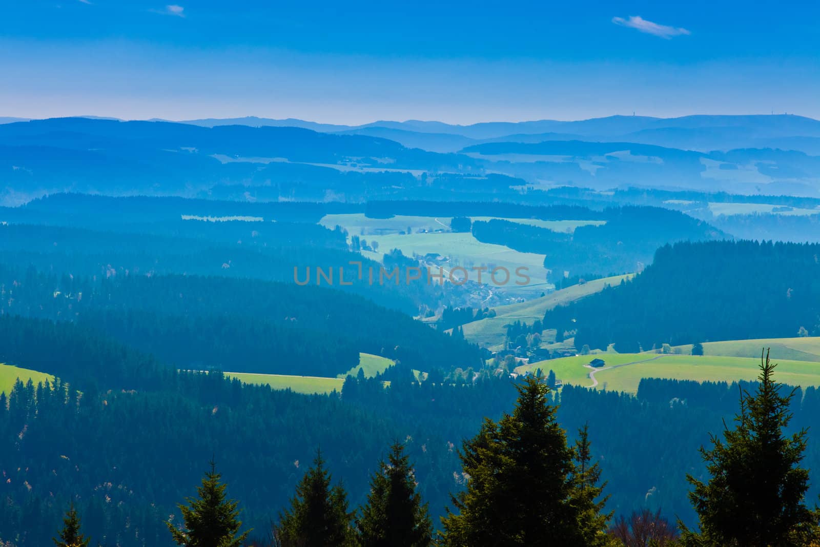 Farmland and forested hills in Black Forest, rural Germany.