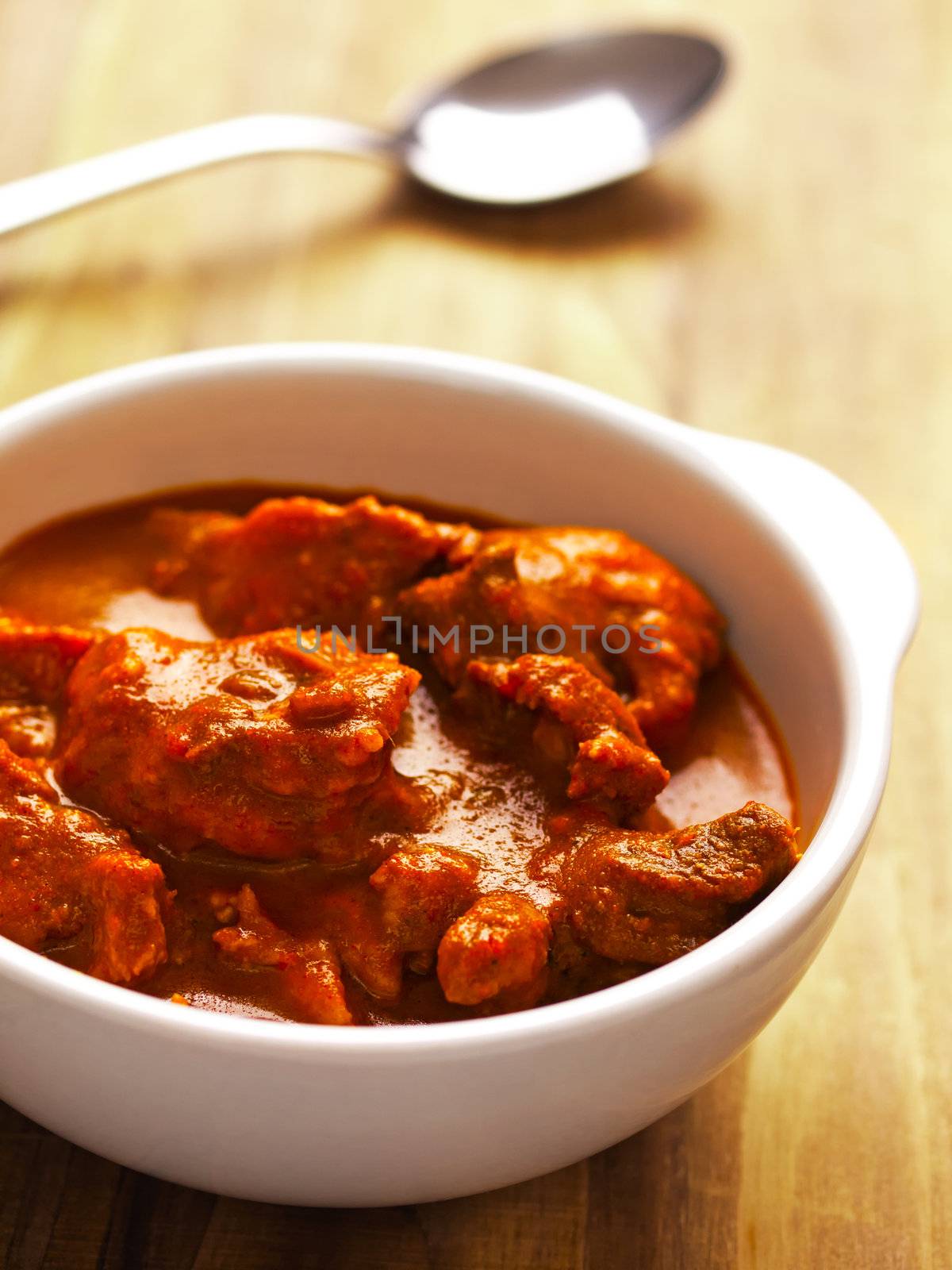 close up of a bowl of indian mutton curry