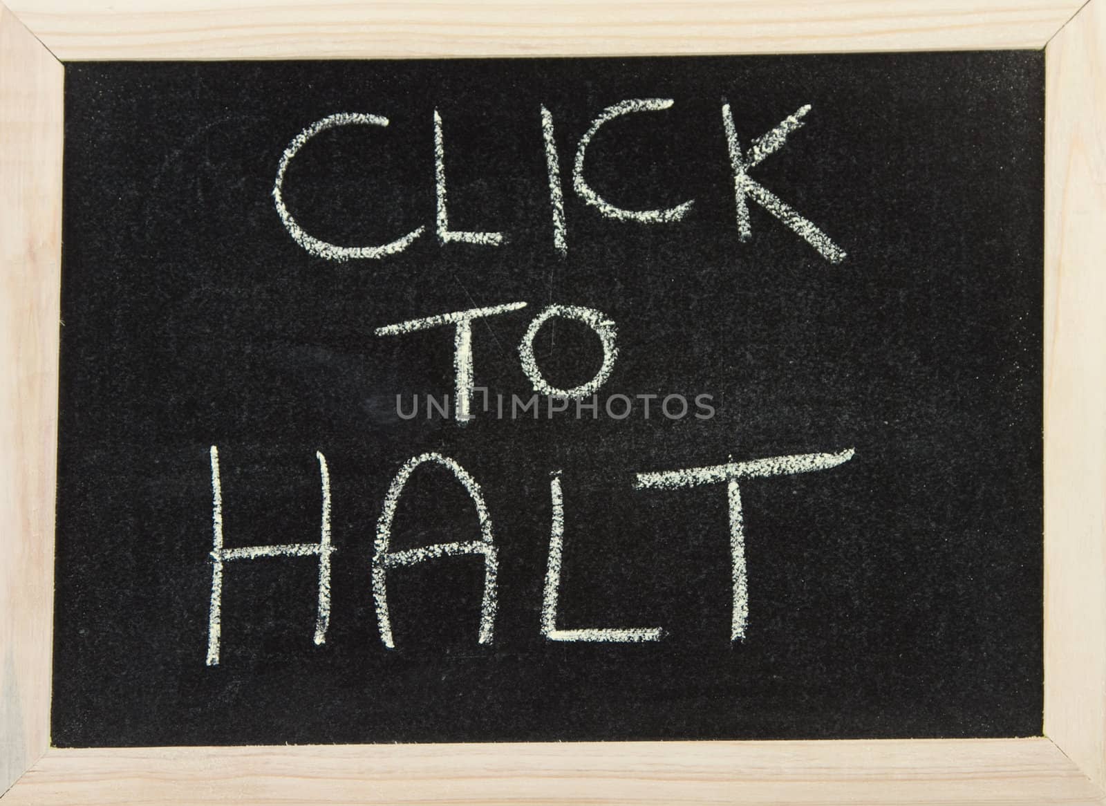 A black board with wooden frame and the hand written words in chalk 'click to halt'.