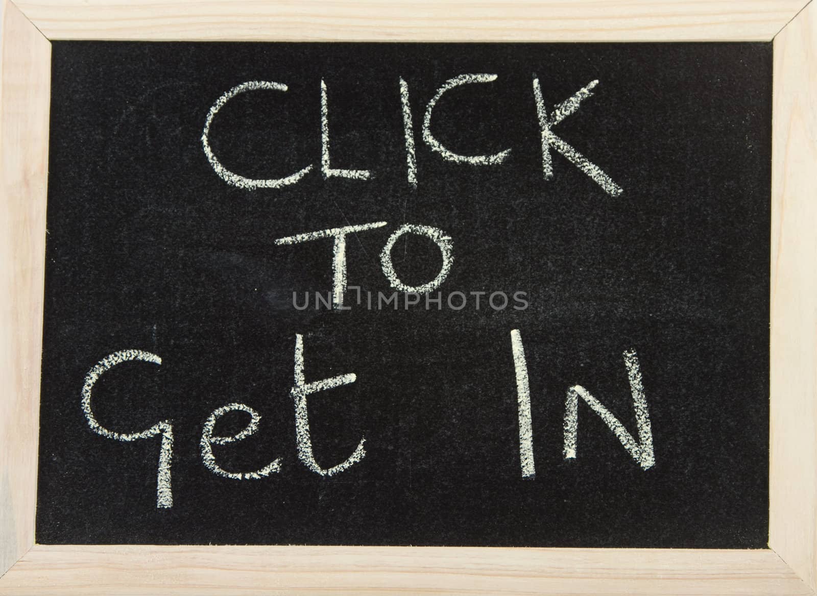 A black board with wooden frame and the hand written words in chalk 'click to get in'.