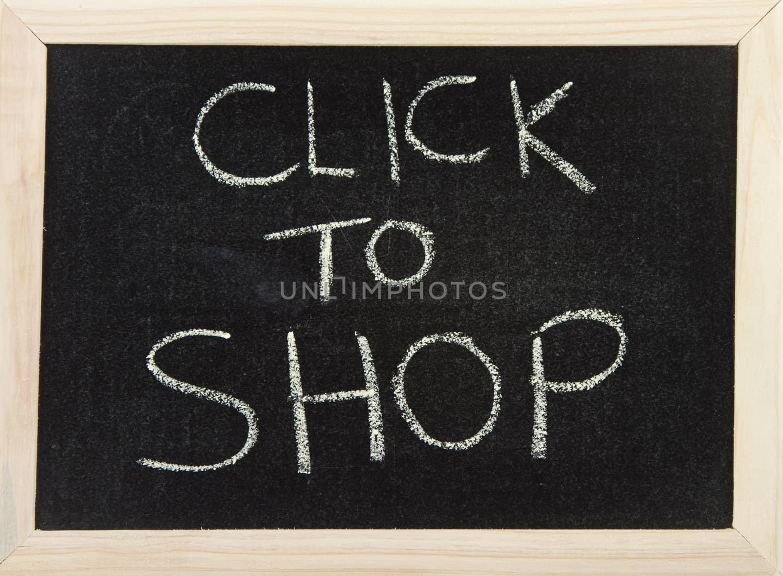 A black board with wooden frame and the hand written words in chalk 'click to shop'.