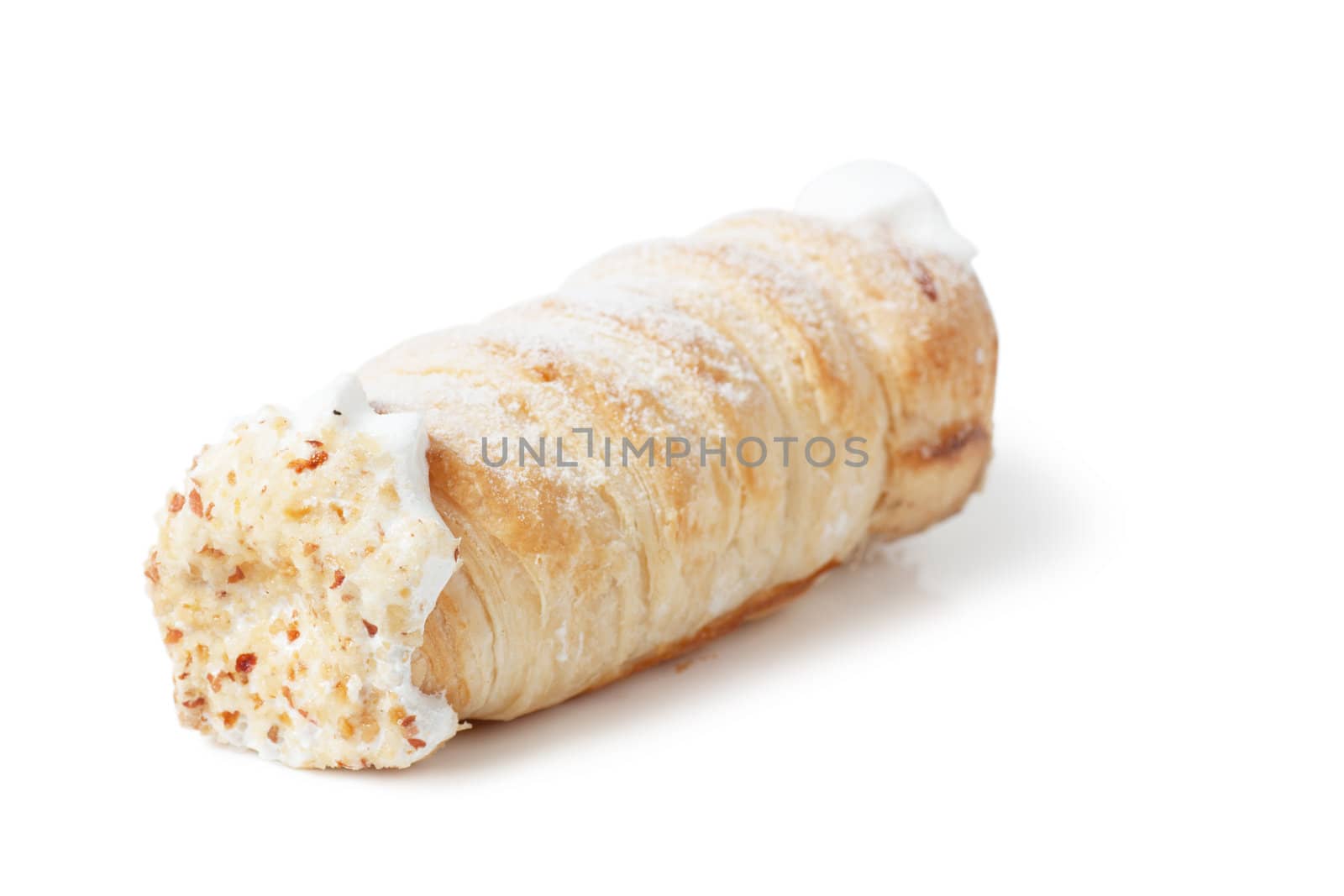 Single pastry with cream isolated over white background