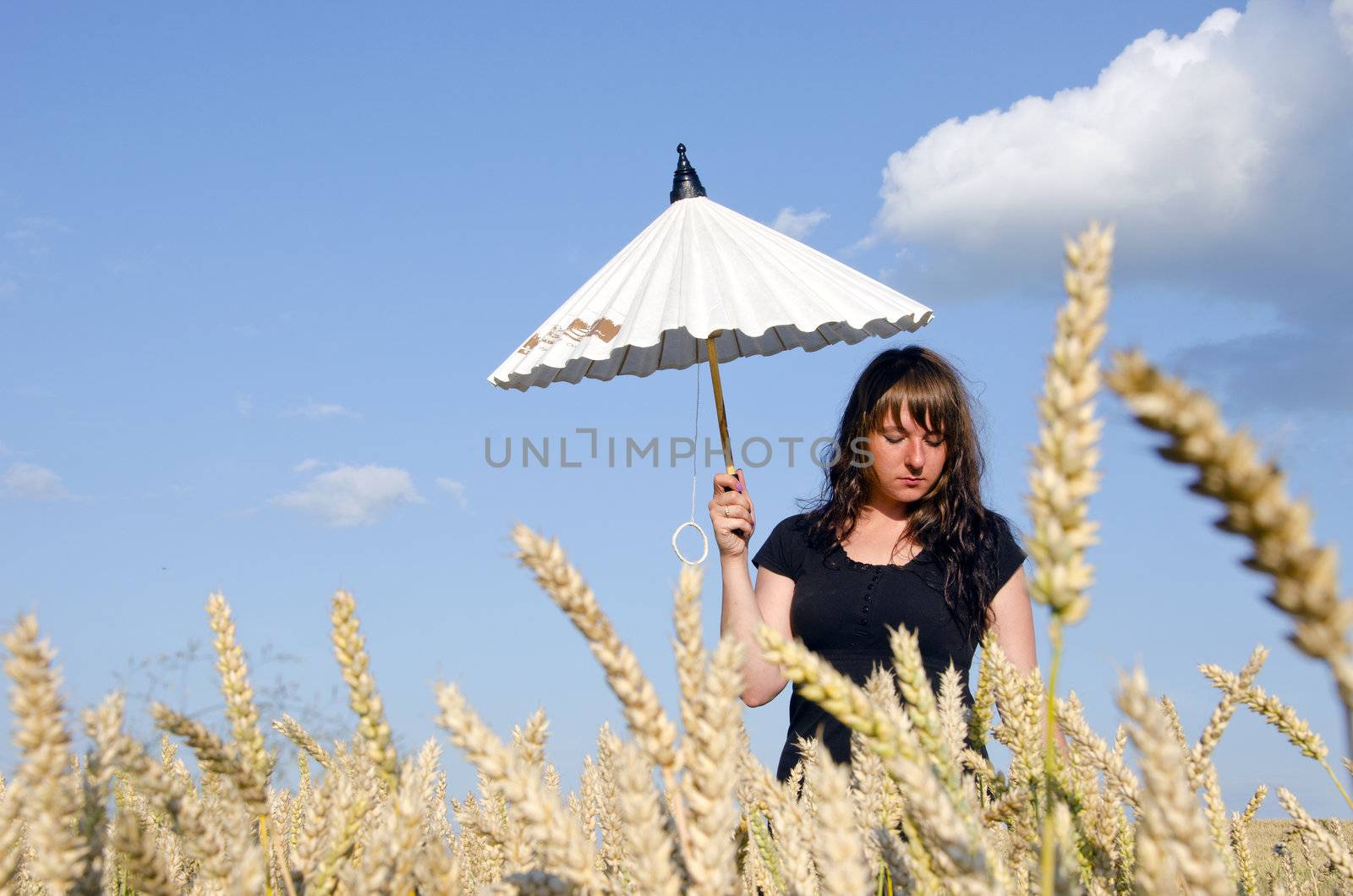 Young woman with umbrella. by sauletas