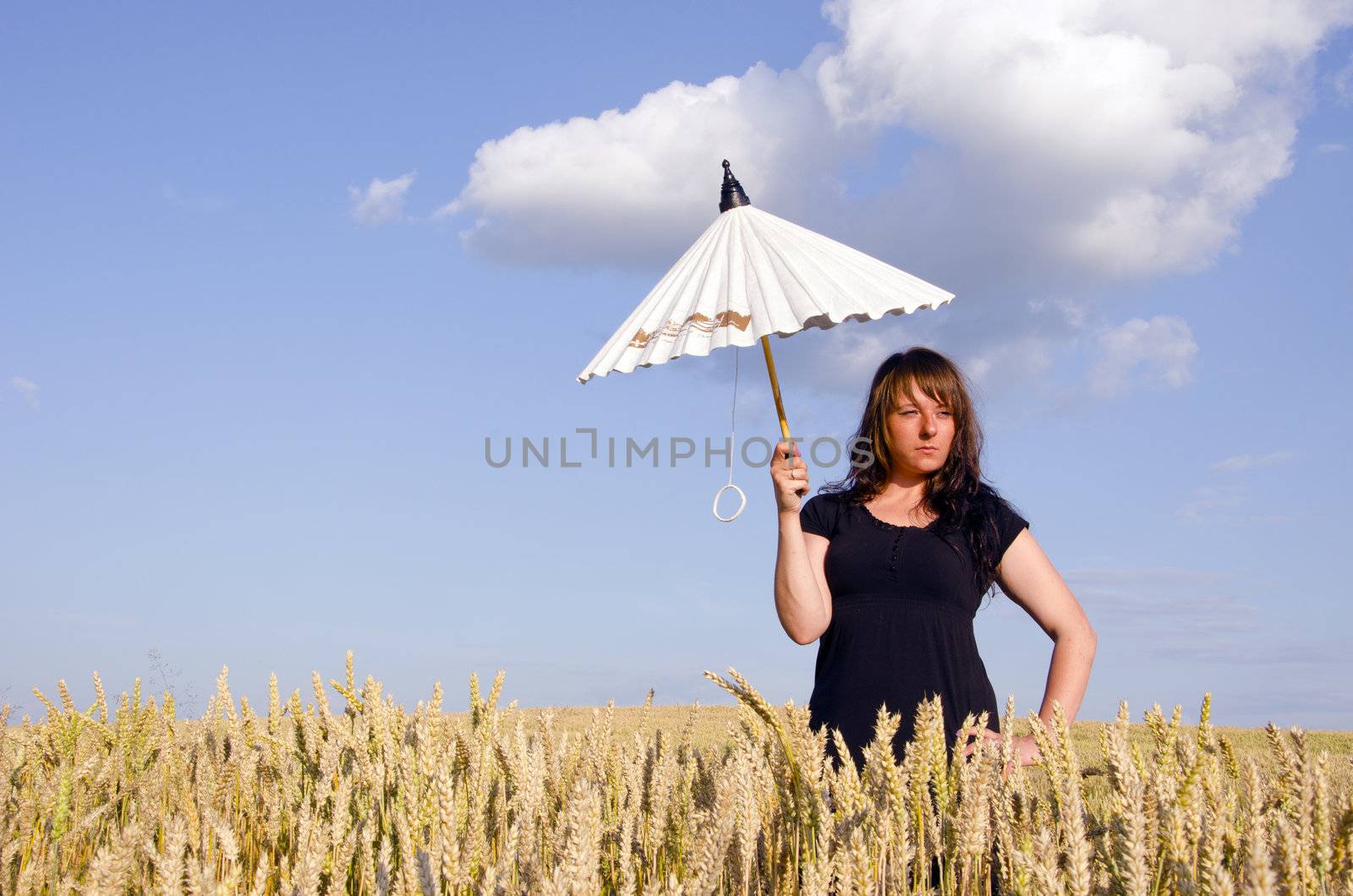 Young woman with umbrella. by sauletas