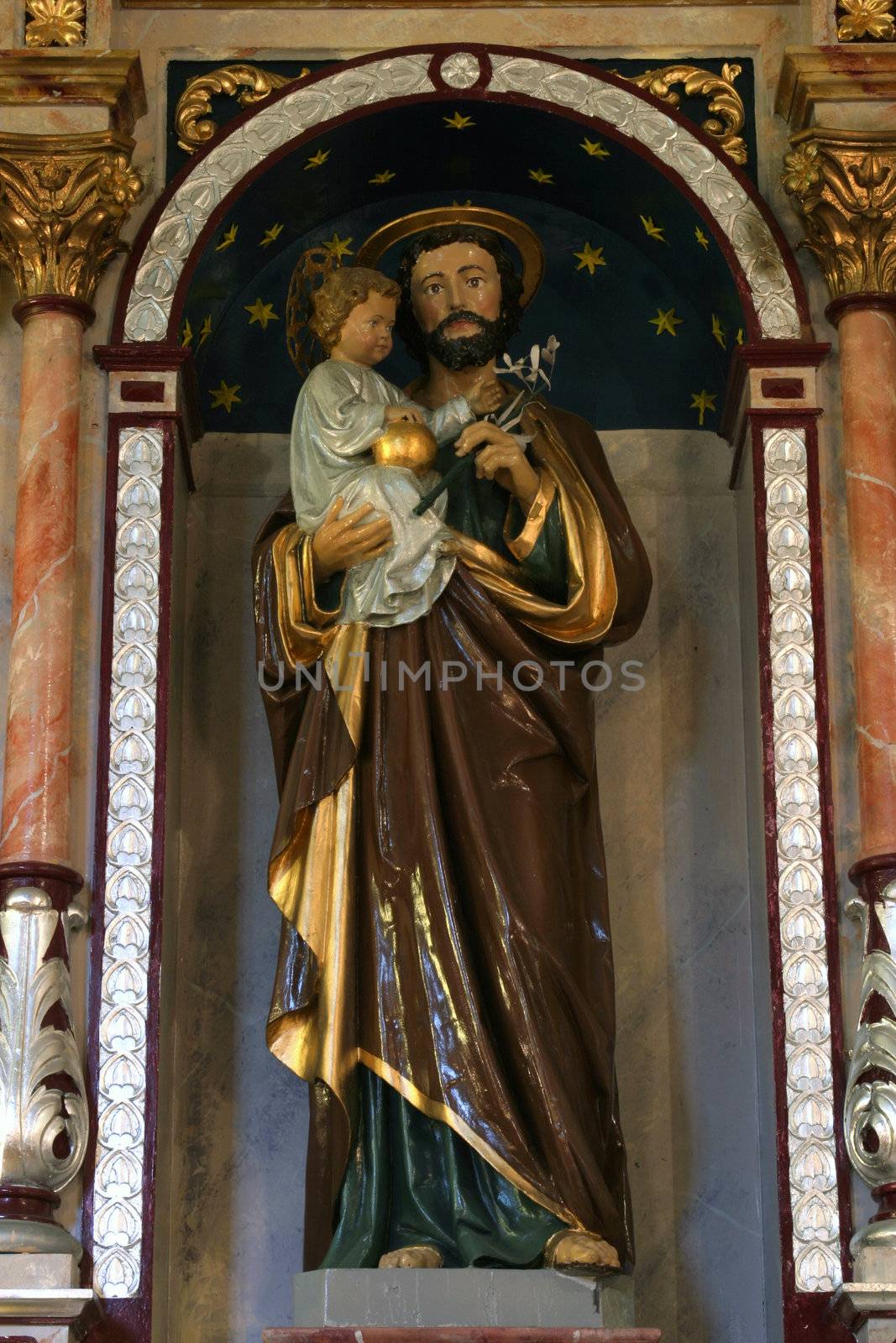 Saint Joseph holding baby Jesus