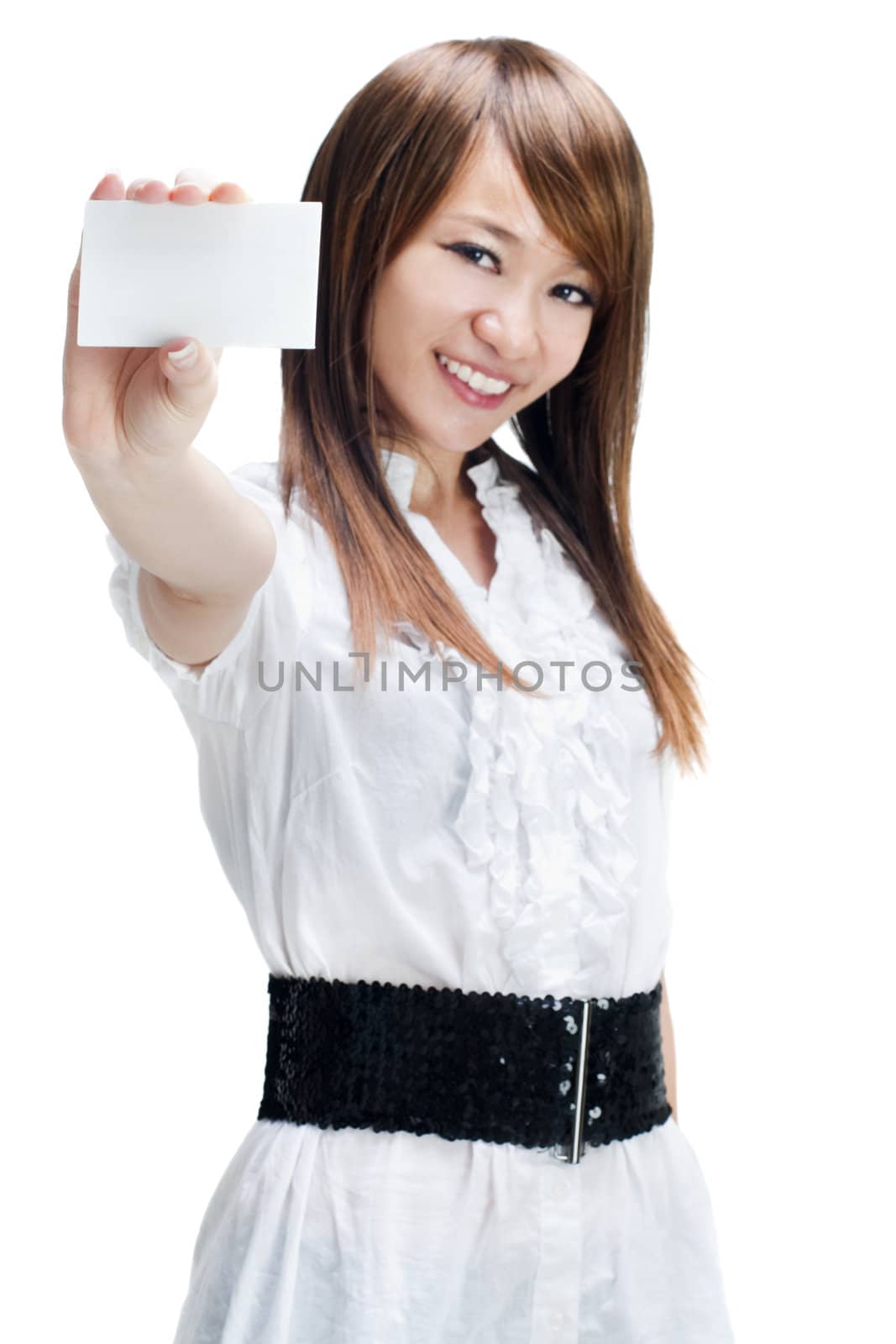 Asian female holding a blank business card and smiling at the camera