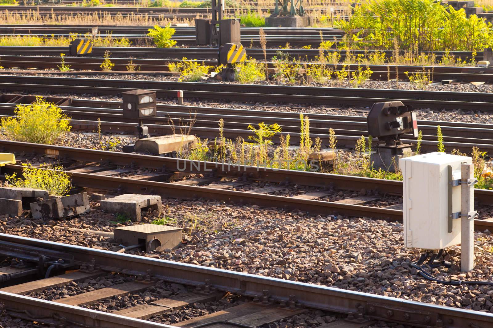 Railway Tracks and control devices near train station.