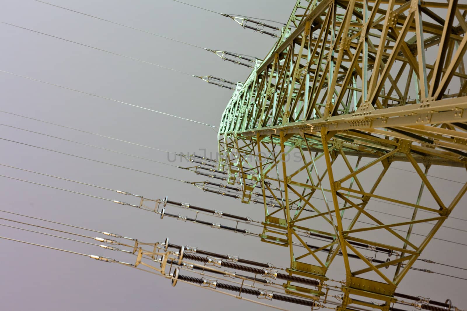 Pylon of high-voltage transmission line at night.