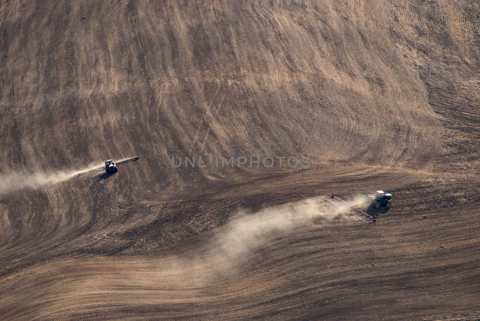 Tractors plowing field after harvest, Whitman County, Washington, USA by CharlesBolin