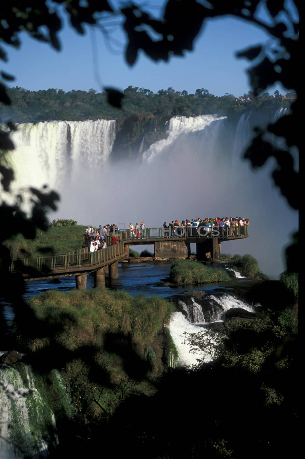 Viewing platform full of people at Iguacu Falls, Brazil.