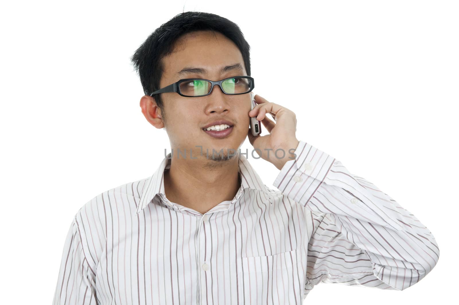 Asian Young Businessman on the phone, looking away.
