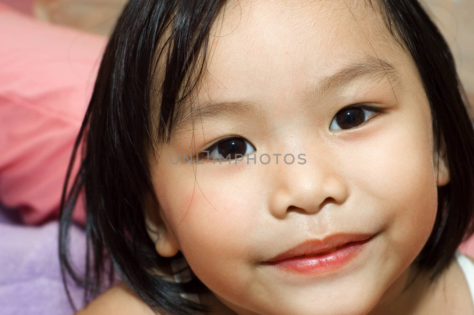 little asian girl with smiling face