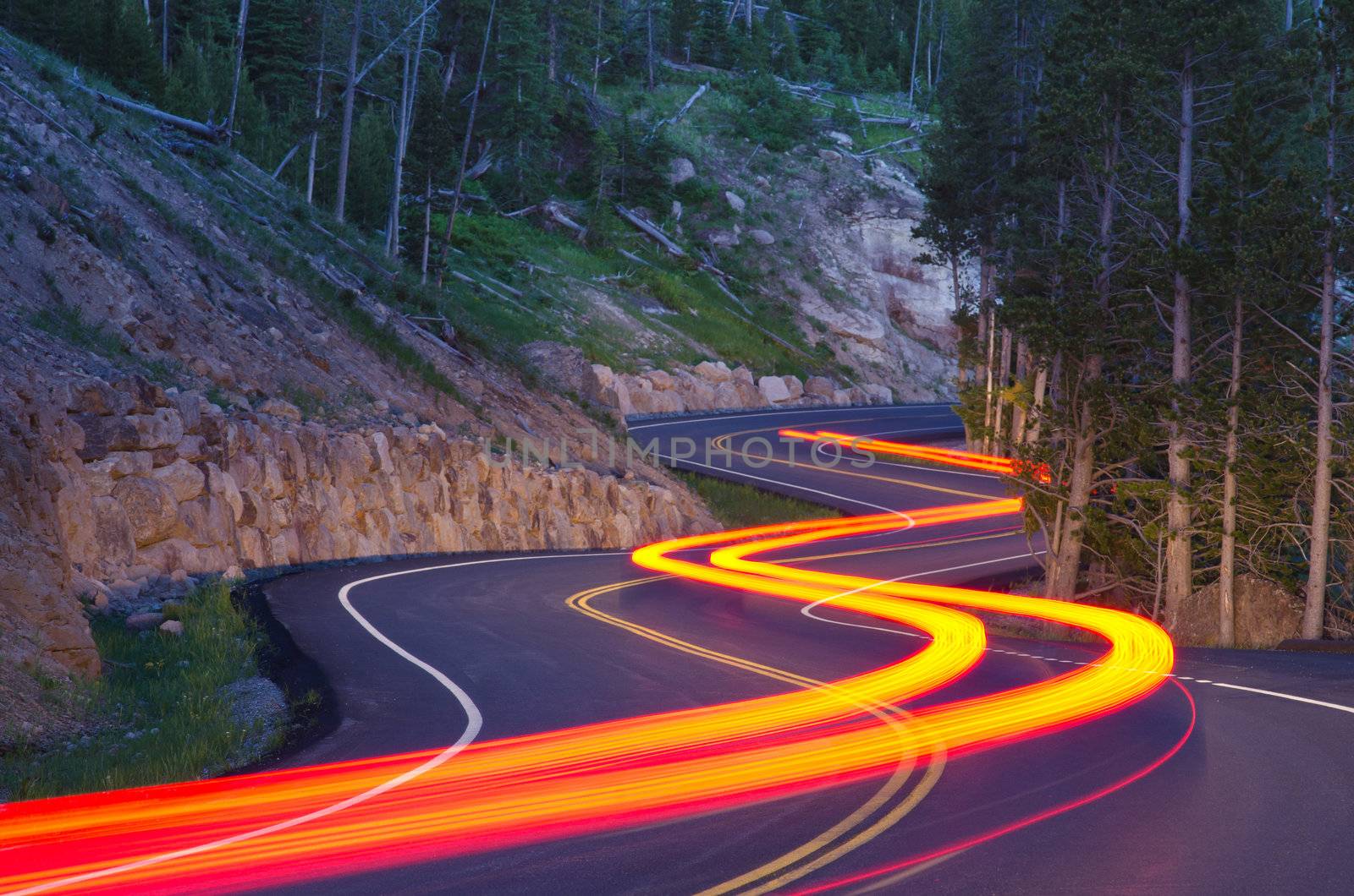 Twilight traffic on the Grand Loop Road in summer, Yellowstone National Park, Park County, Wyoming, USA by CharlesBolin