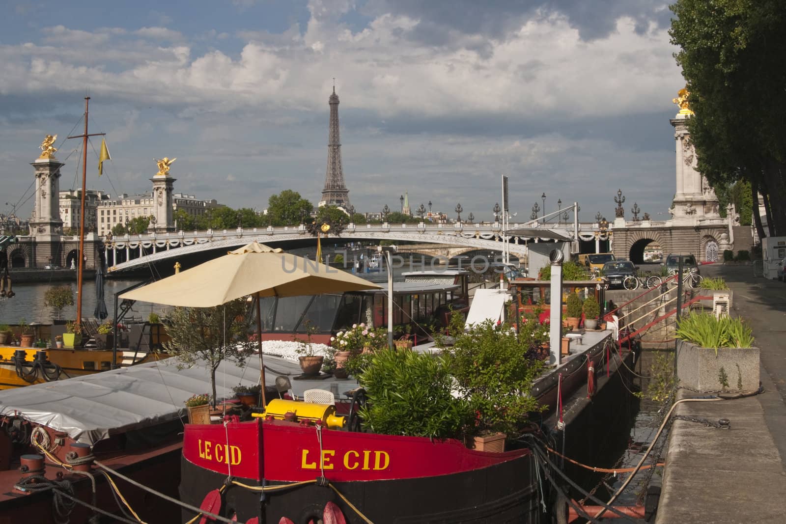 Houseboat tied up to the bank of the River Seine in Paris France