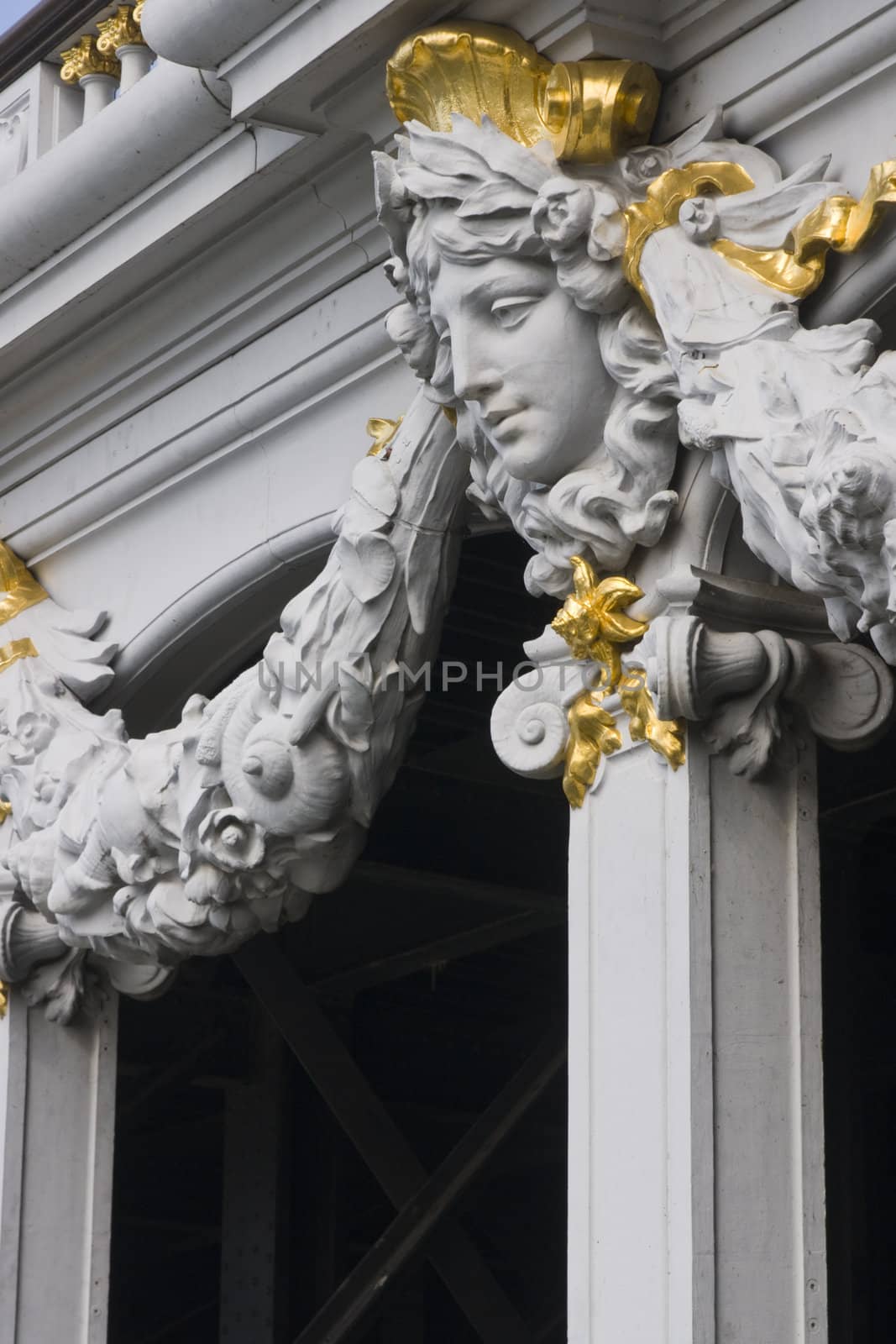 Detail of statue on a historic bridge (Pont Alexandre III) over the River Seine in Paris, France.