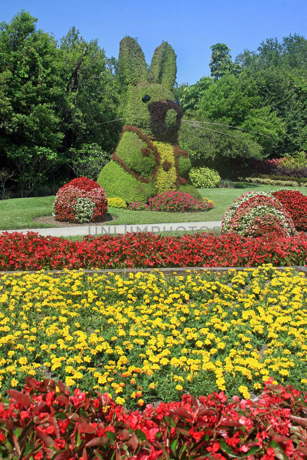 A large bunny topiary in beautiful gardens