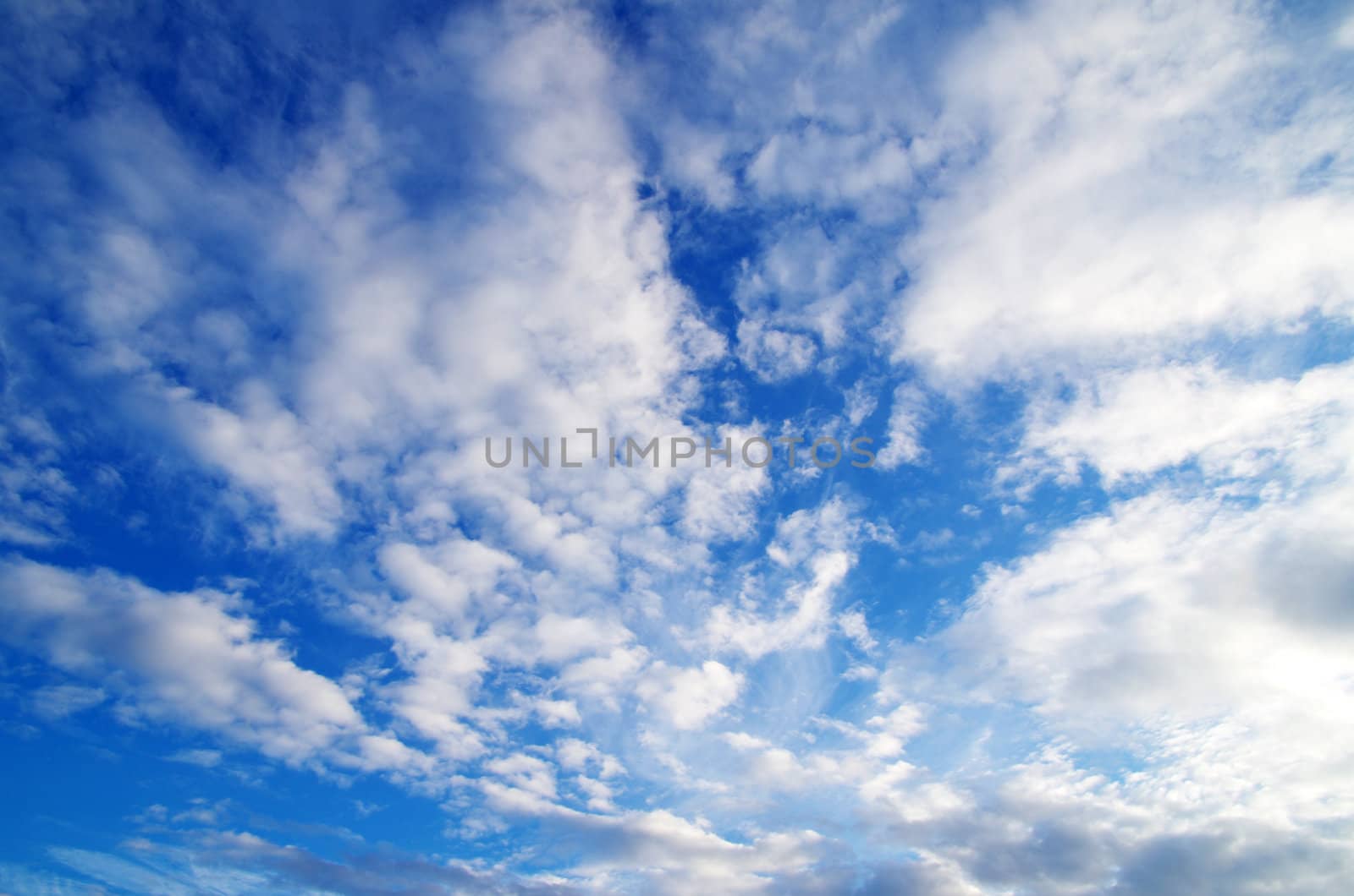 blue sky background with tiny clouds
