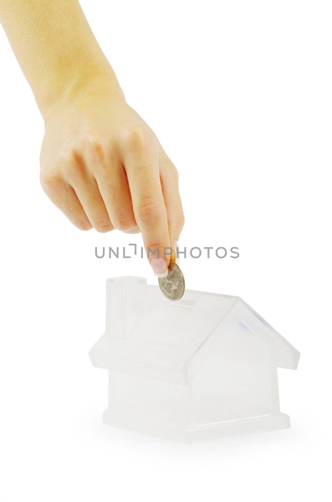 Hand with coin and house bank isolated on white background
