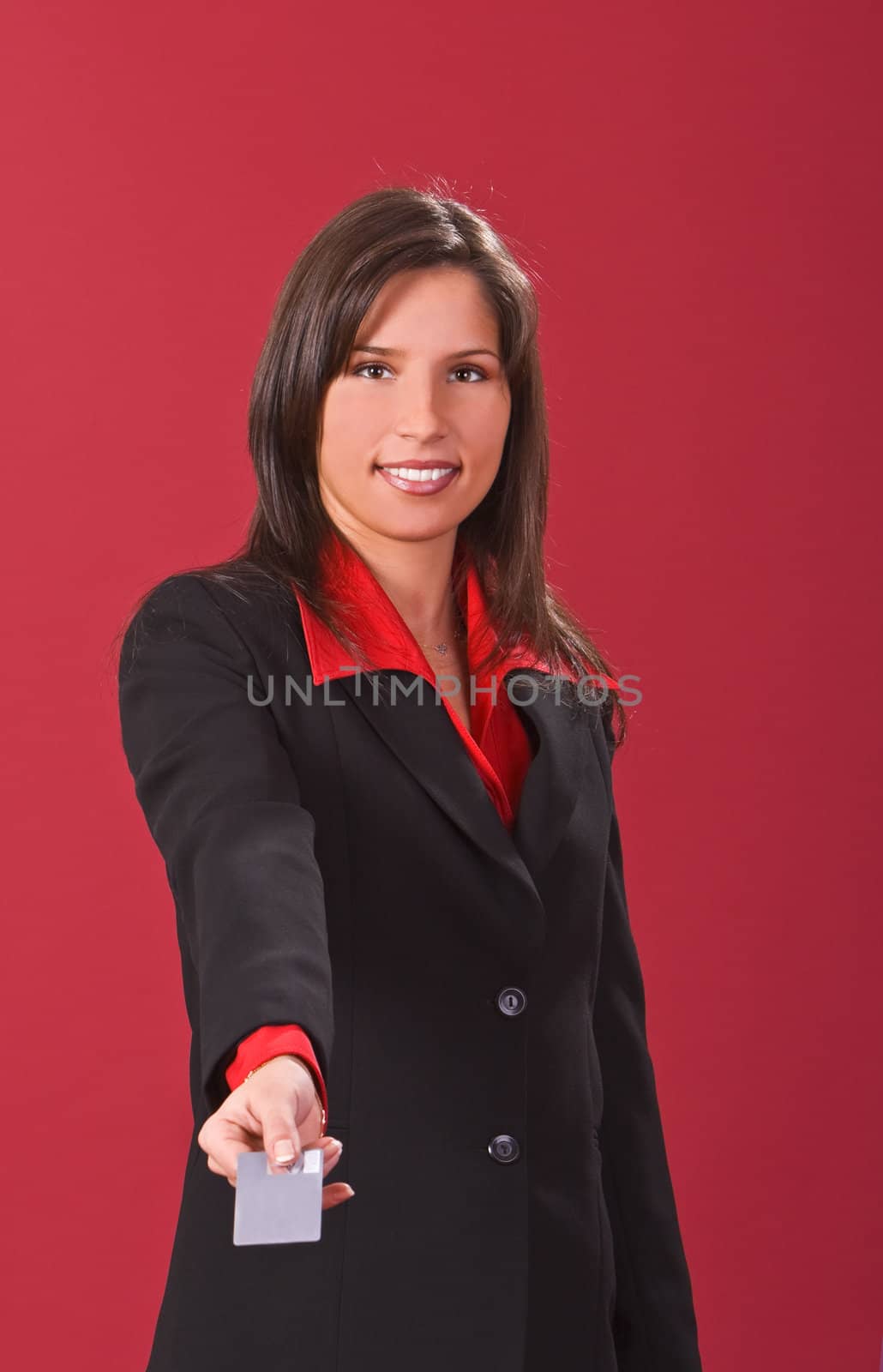Image of a businesswoman offering a credit card.Shot with Canon 70-200mm f/2.8L IS USM