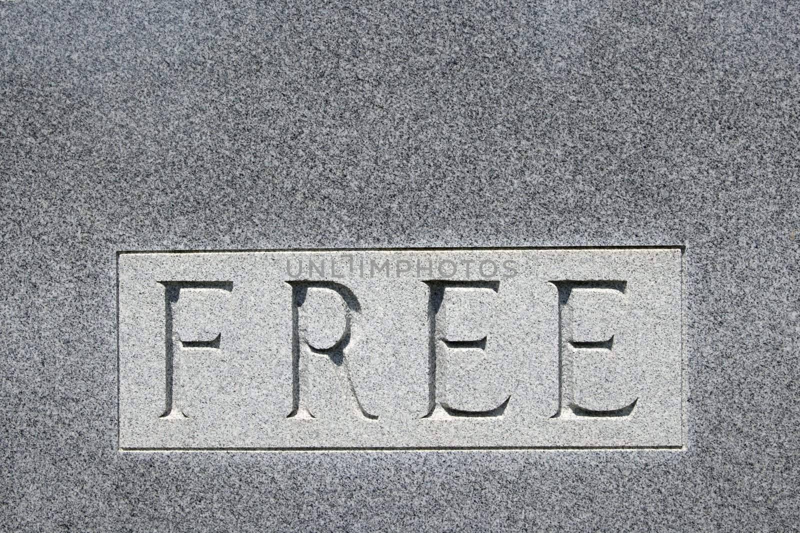 Word "free" on gravestone. by iofoto