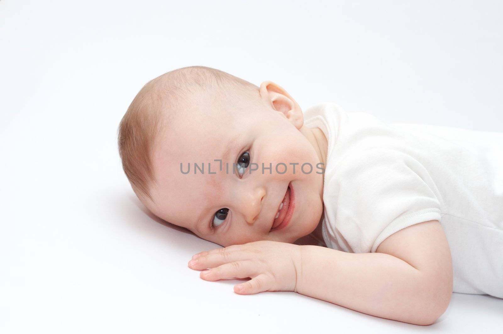 Smiling baby lying on the floor