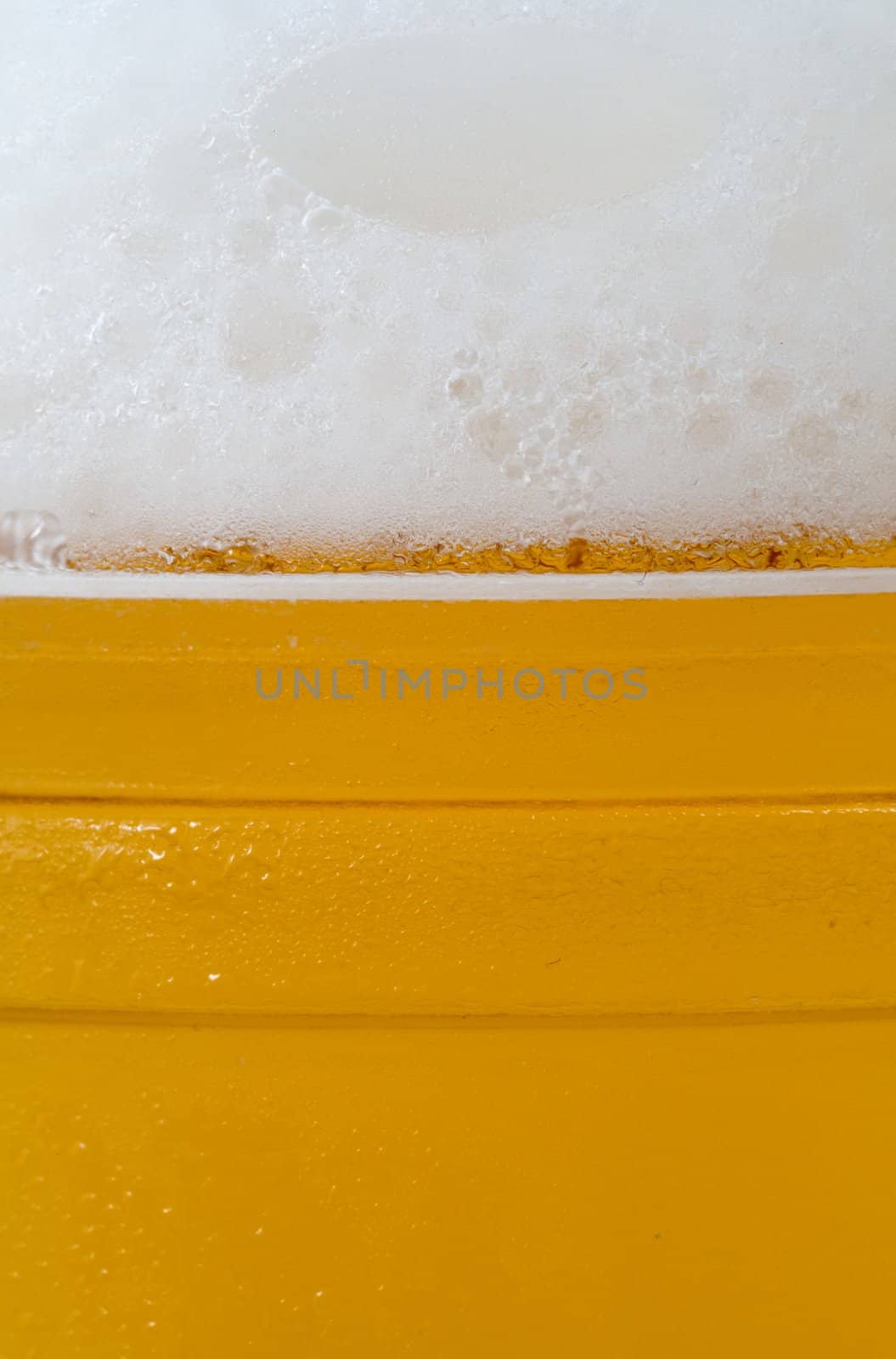 close-up of glass of beer with foam