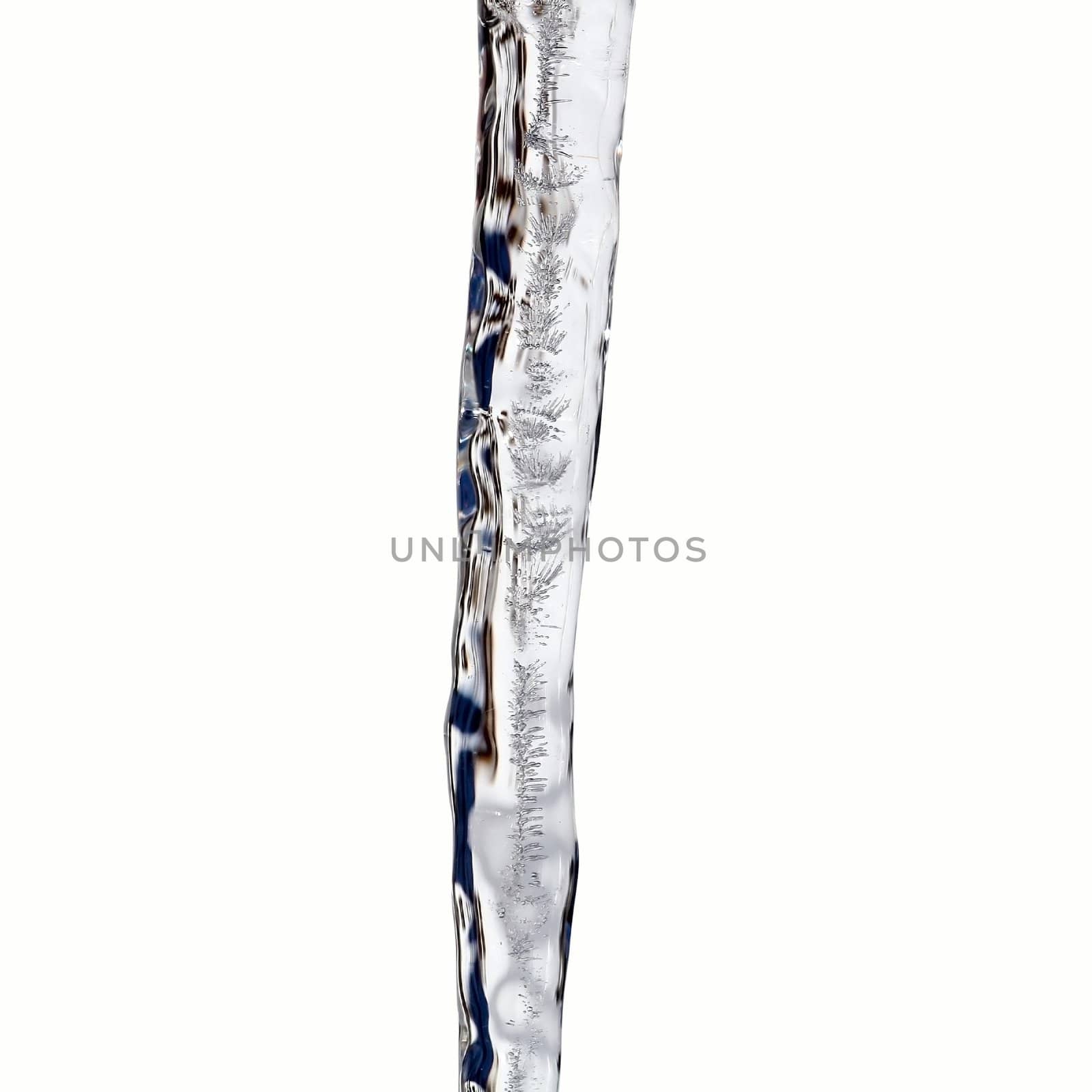 Close view of a icicles with wonderful structures isolated on a white background
