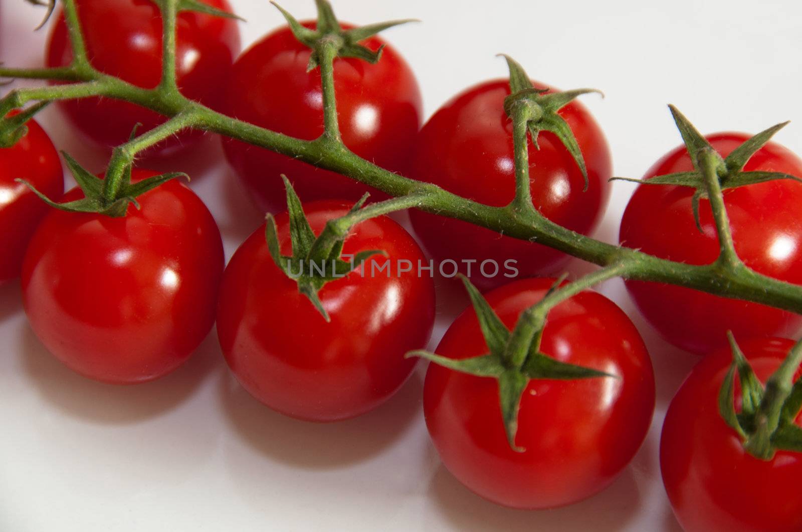 Closeup of cherry tomatoes on the vine