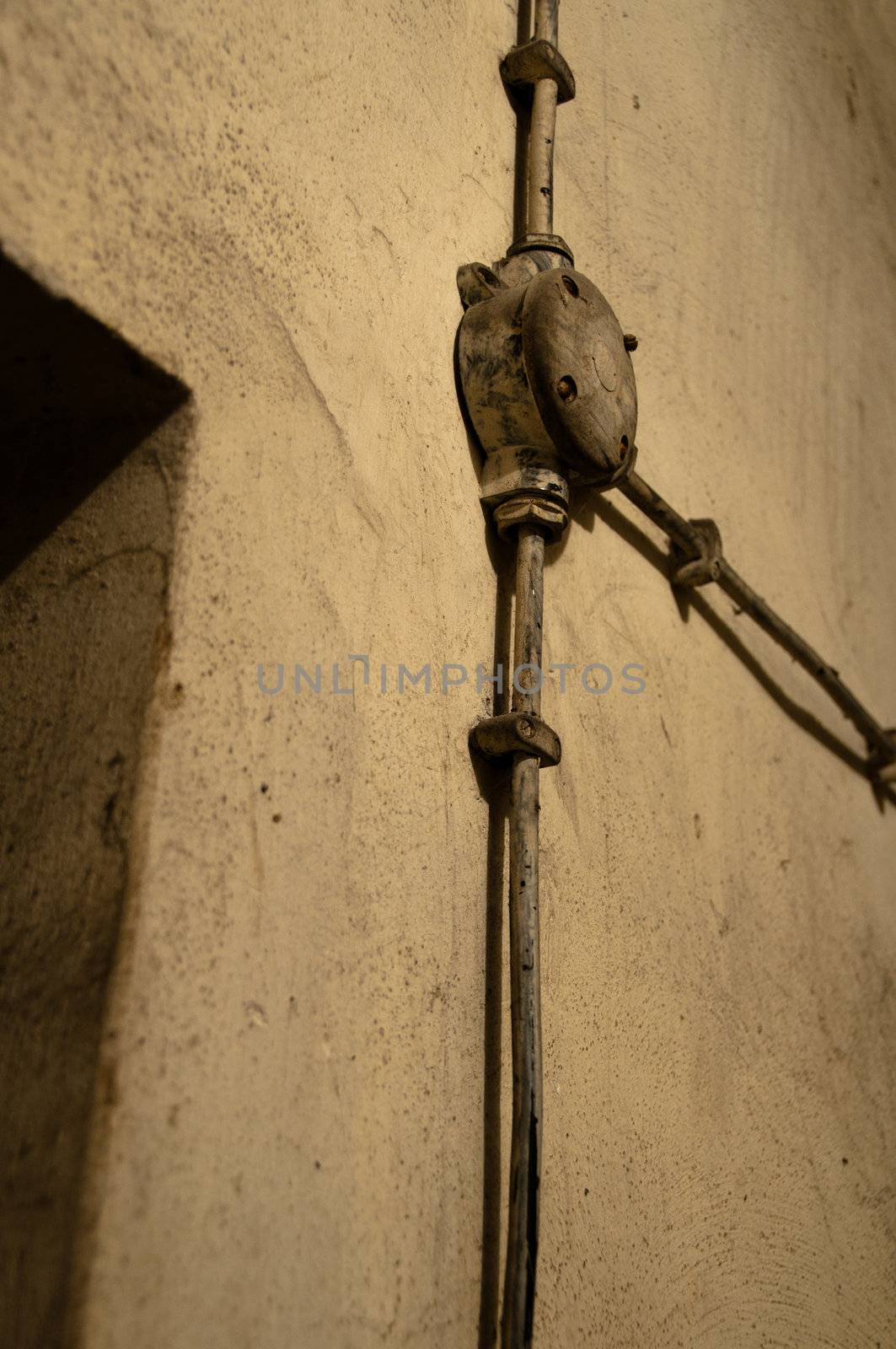 Old electric equipment mounted on cellar wall