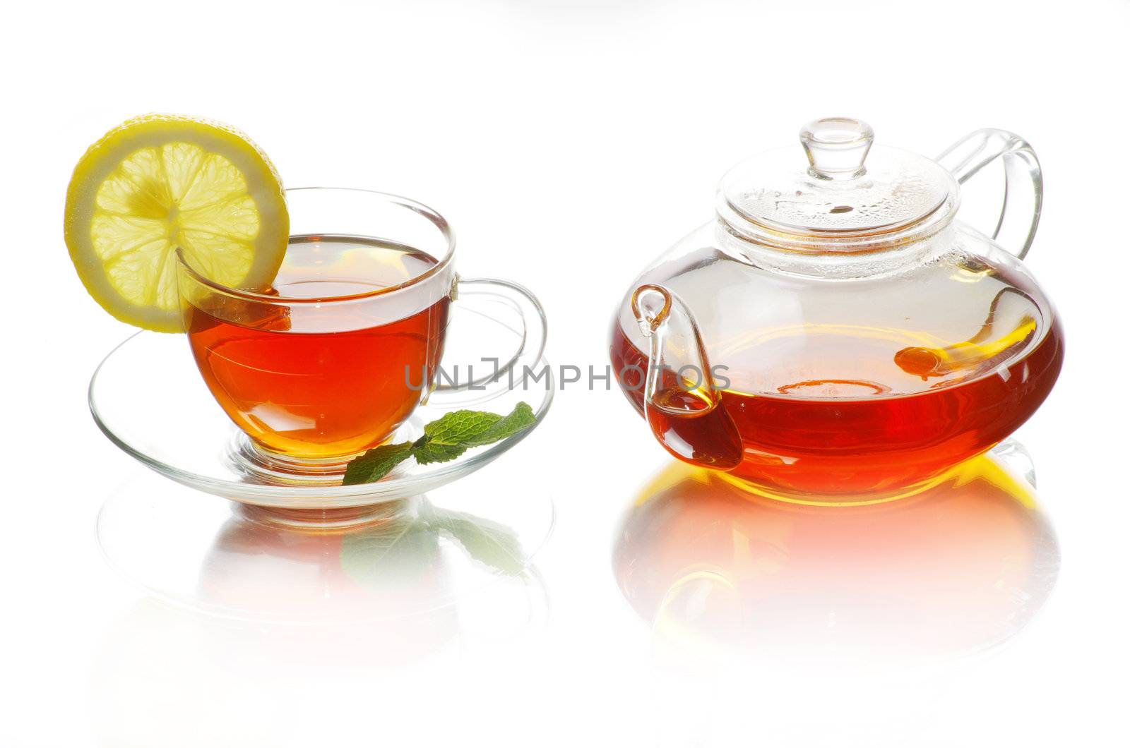 Tea being poured into glass tea cup