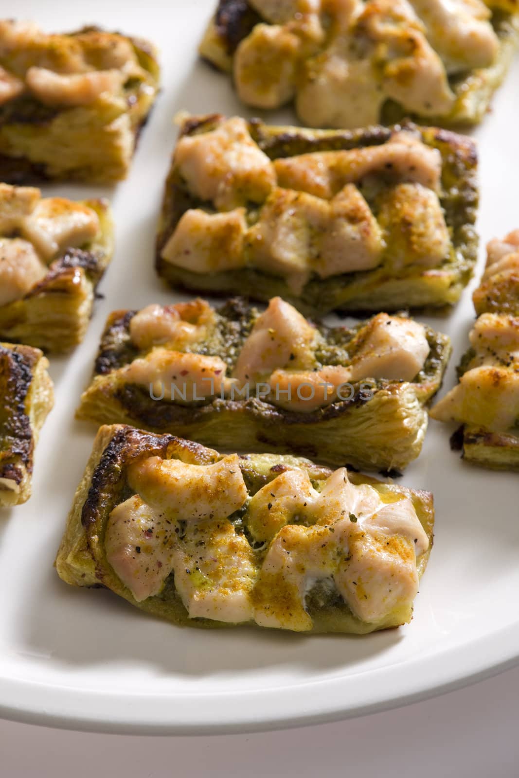 baked chicken meat with pesto on puff
