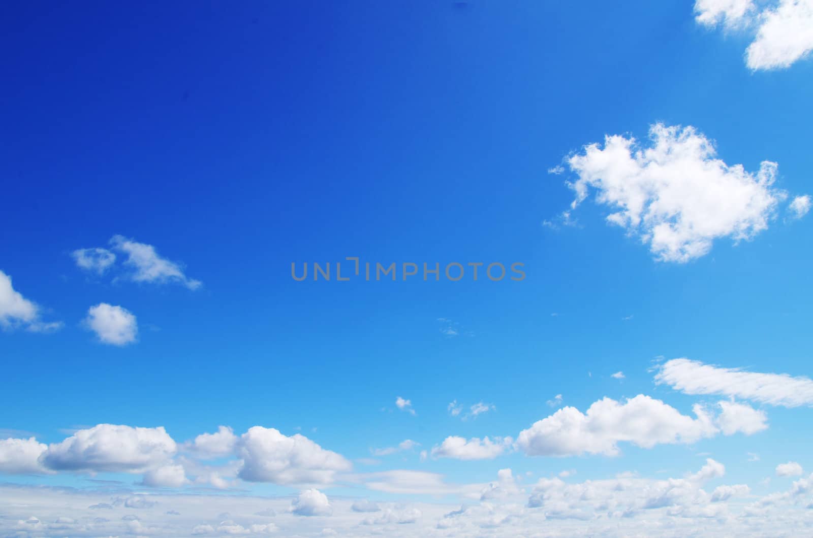 blue sky with clouds and sun