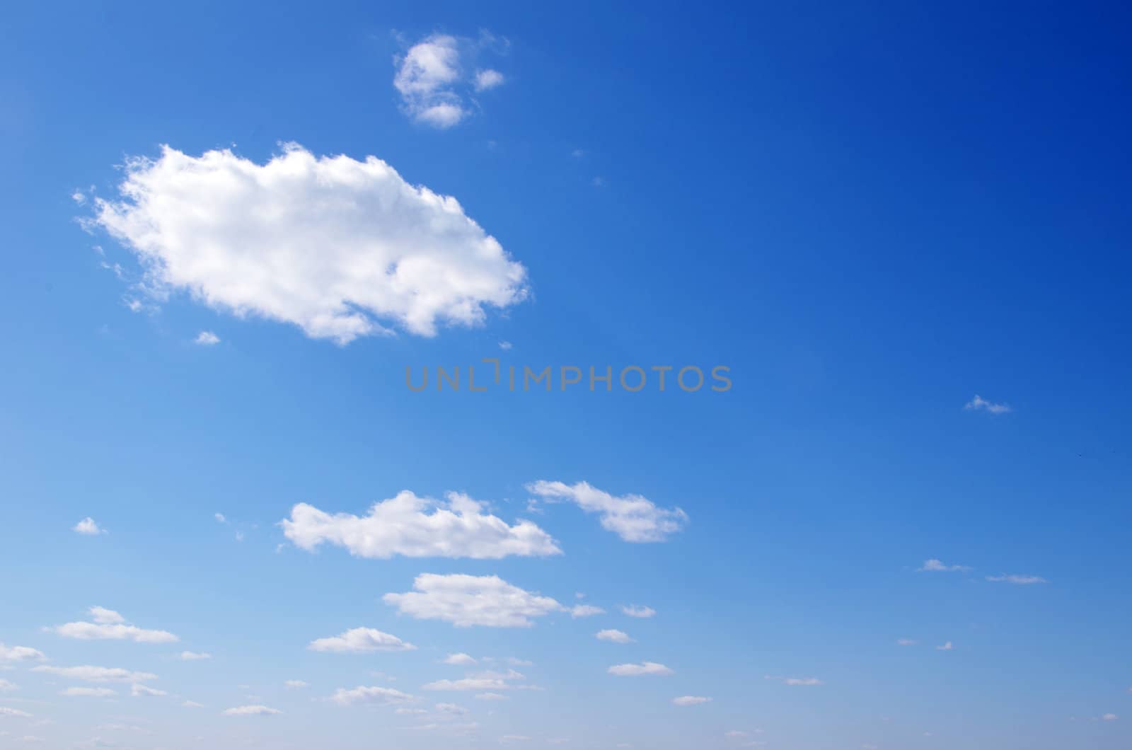 blue sky background with tiny clouds