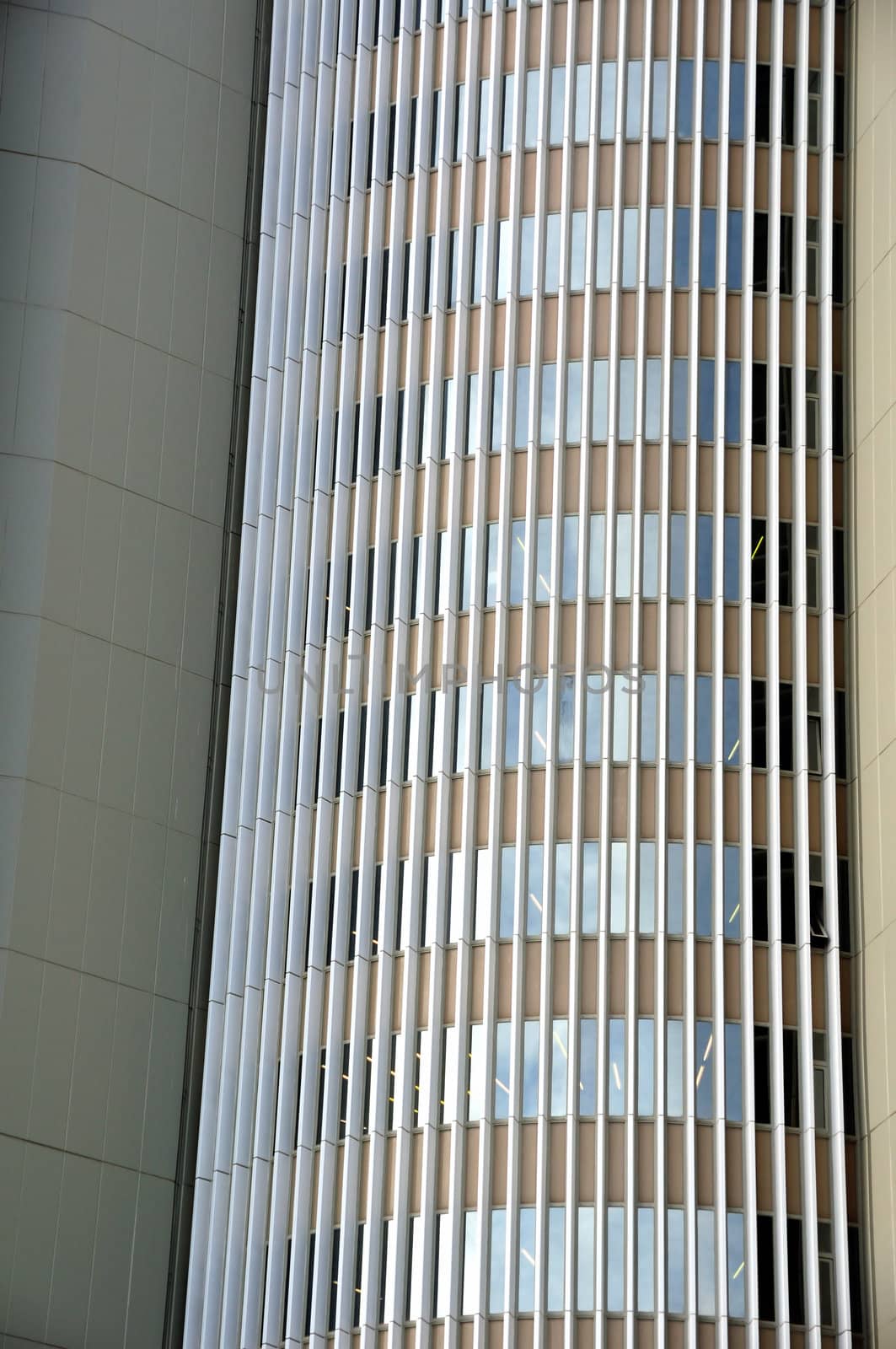 Glass facade of a modern office building. Architectural background.