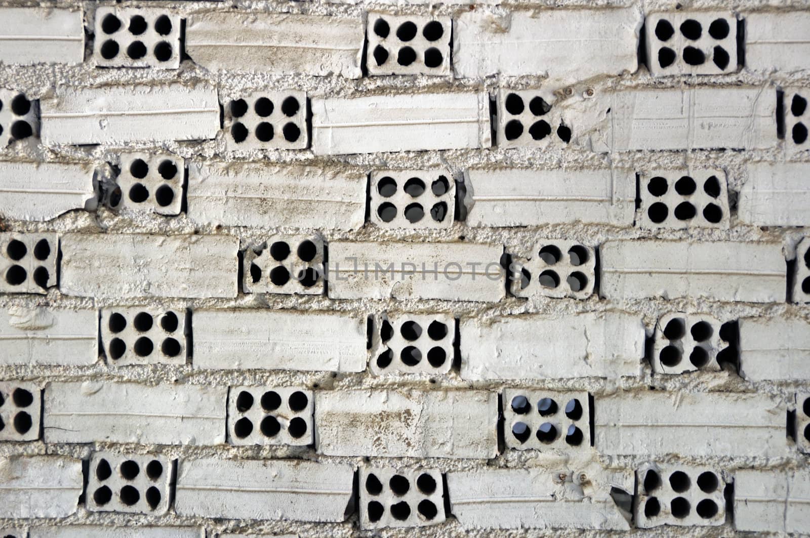 Weathered white brick wall texture background.