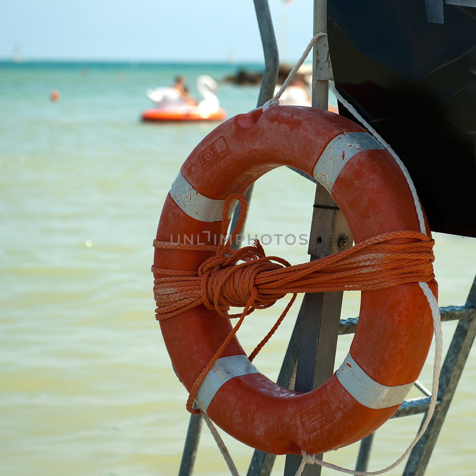 a lifebuoy on the beach on a sunny day